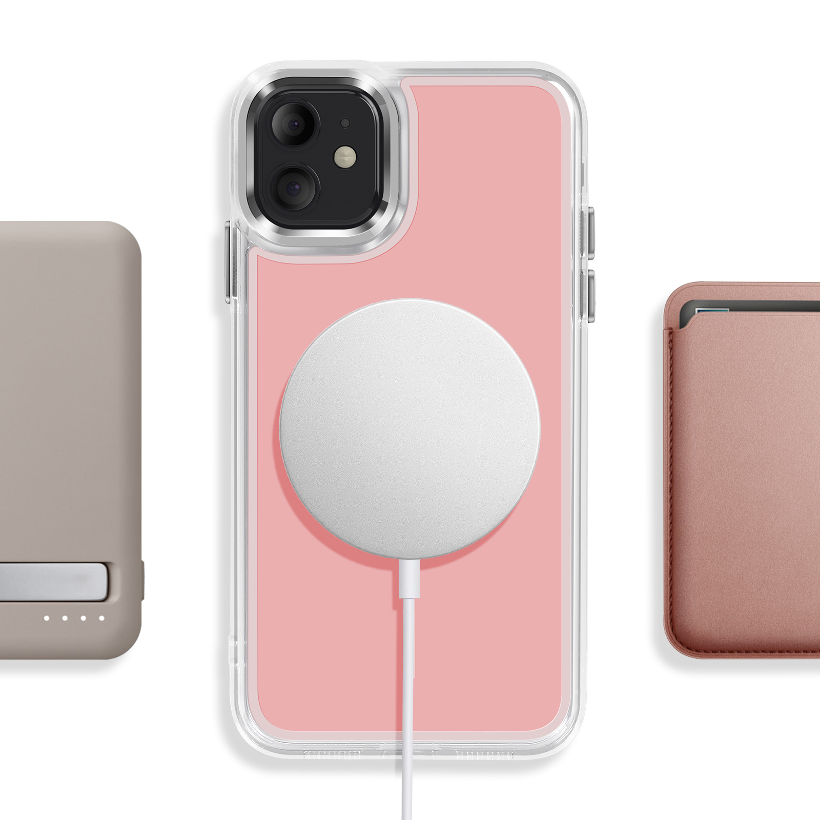 iPhone avec dos rose, chargeur MagSafe et accessoire.