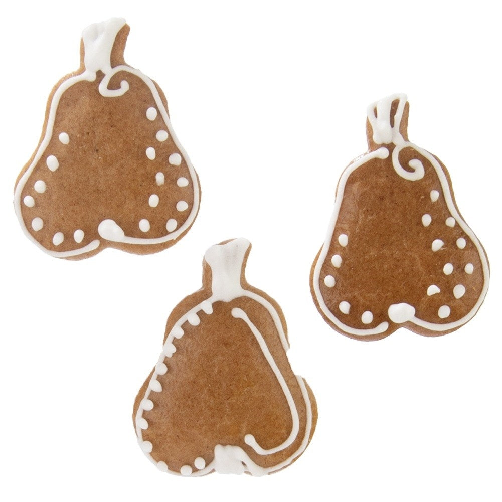 Tres galletas de jengibre con forma de pera decoradas con glaseado blanco.