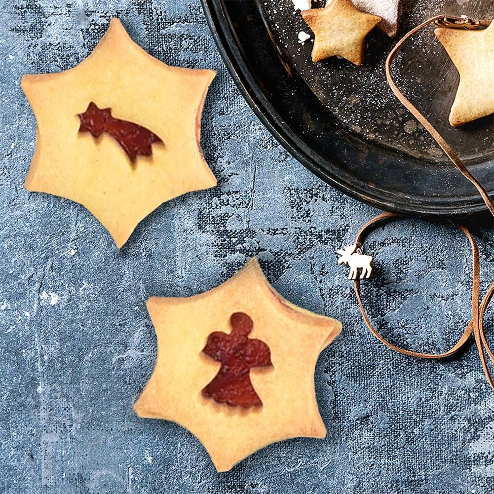 Galletas en forma de estrella con recortes: un cometa y un ángel.