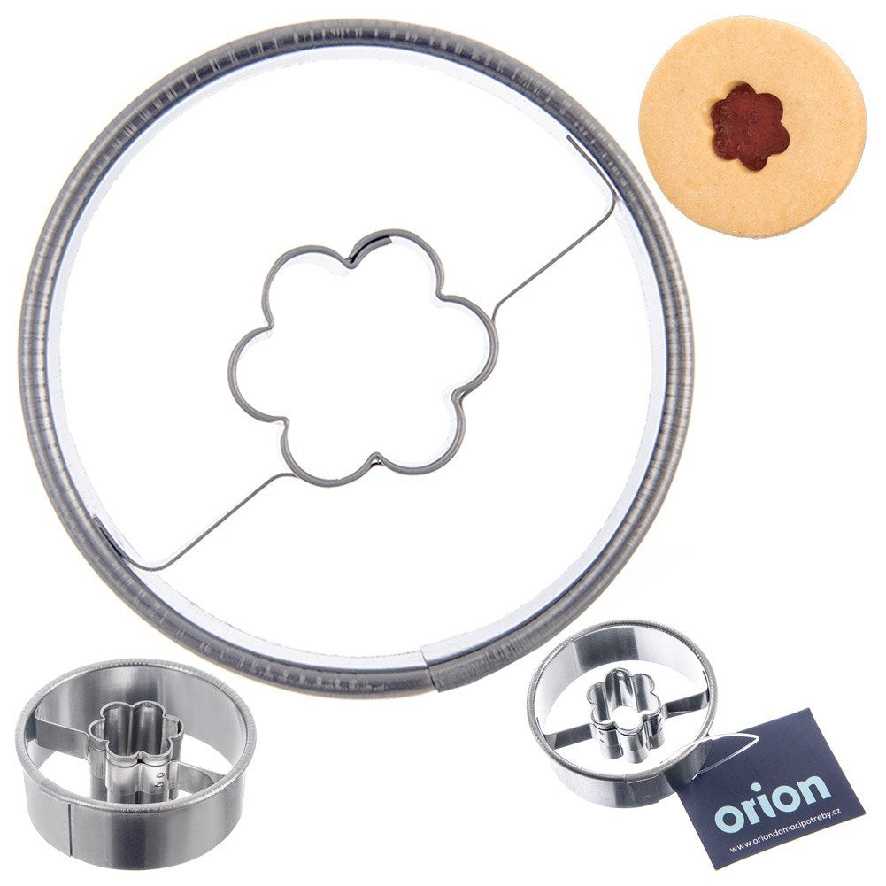 Juego de cortadores de galletas con marco redondo y diseño de flor. Se muestra una galleta.