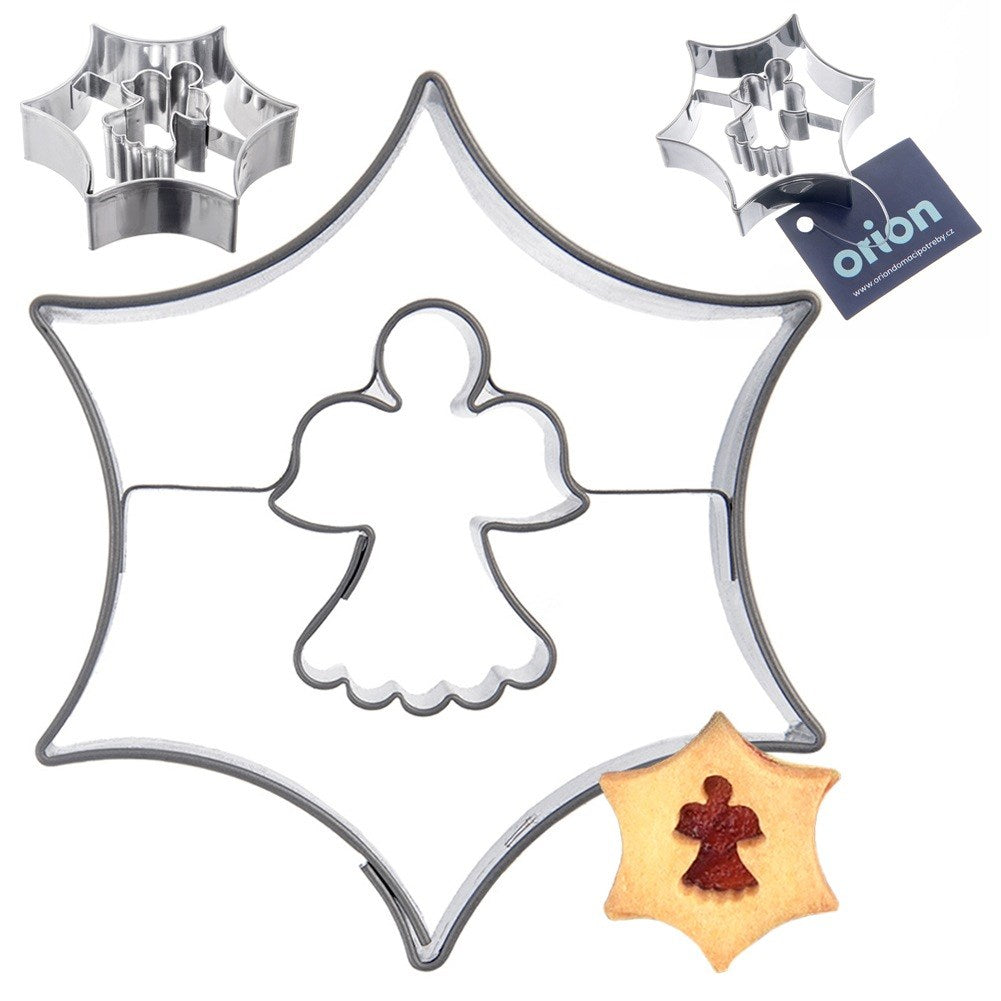 Cortadores de galletas en forma de estrella con motivo de ángel y una galleta.