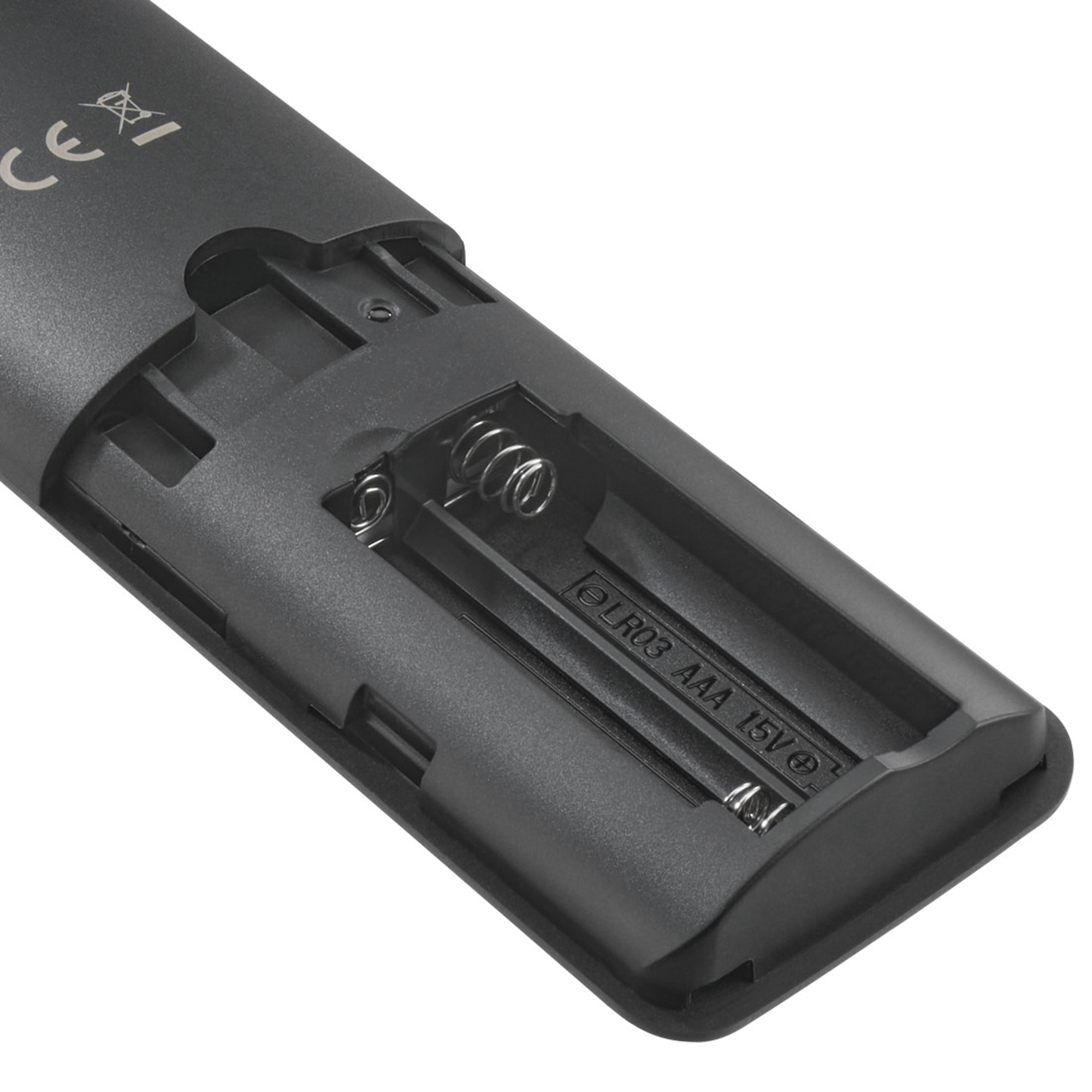 Nahaufnahme des offenen Batteriefachs eines schwarzen Geräts mit Federn.