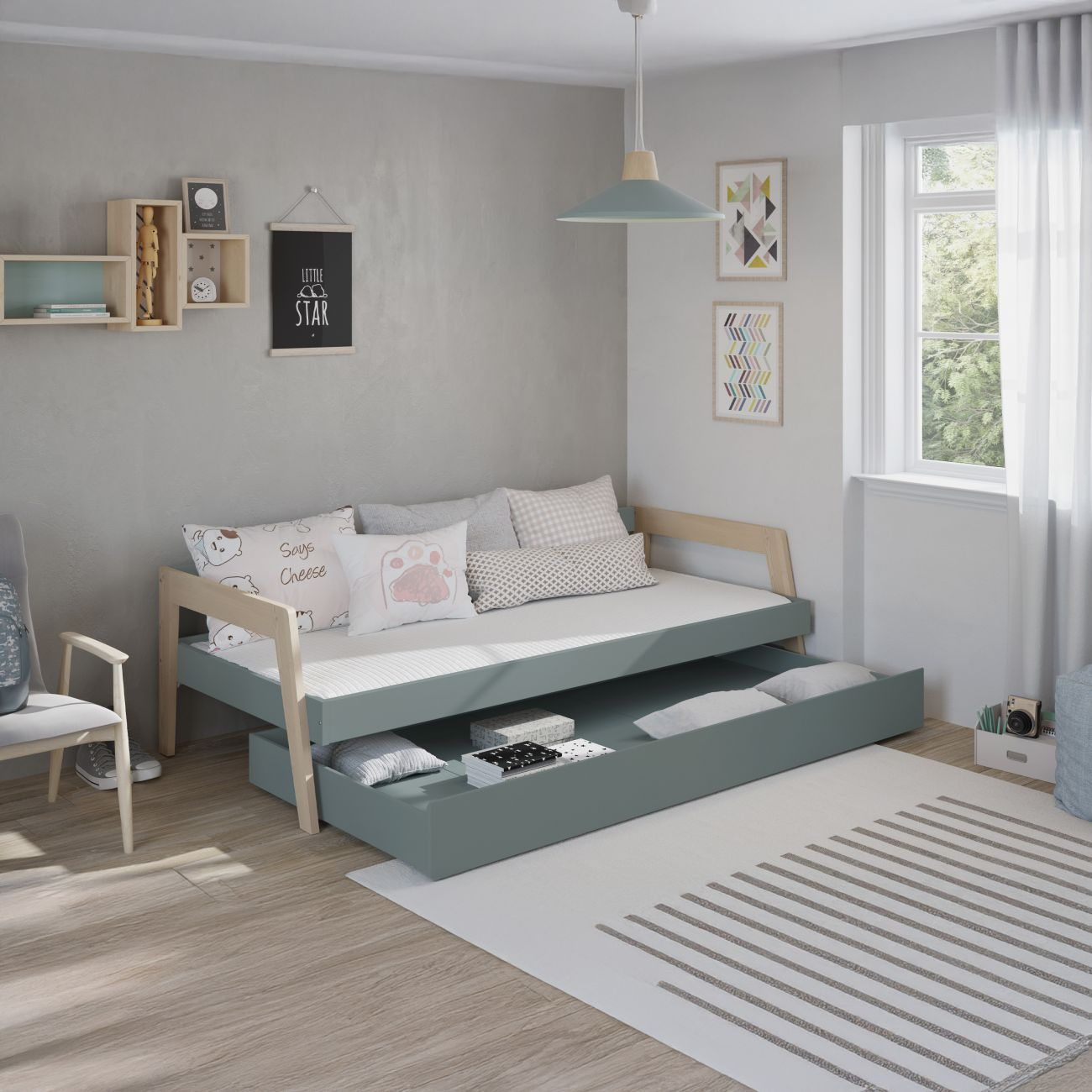 Un diván con cama nido extraíble y almacenamiento en una habitación infantil.