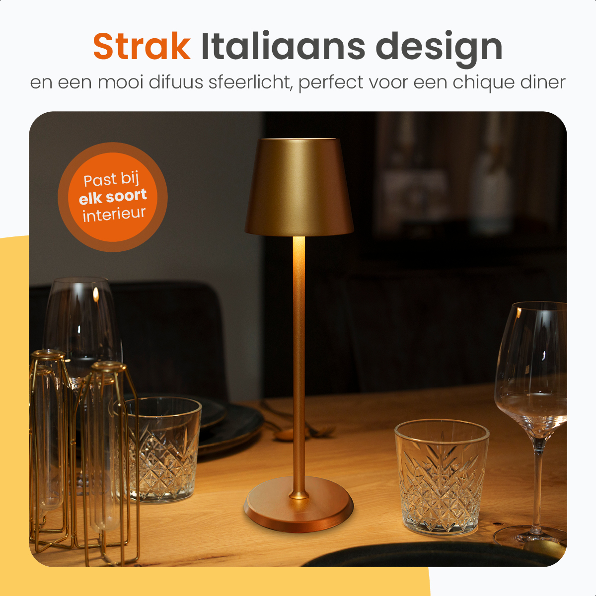 Golden table lamp on a wooden table with glasses. Fits any interior style.