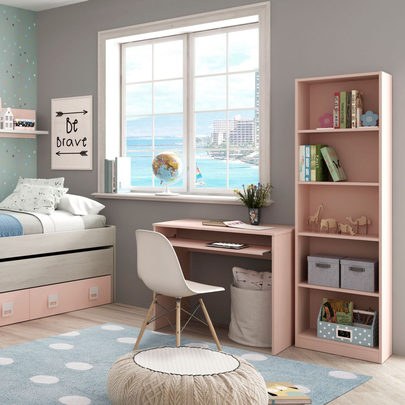 Habitación infantil con cama, escritorio, estantería y vistas al mar.