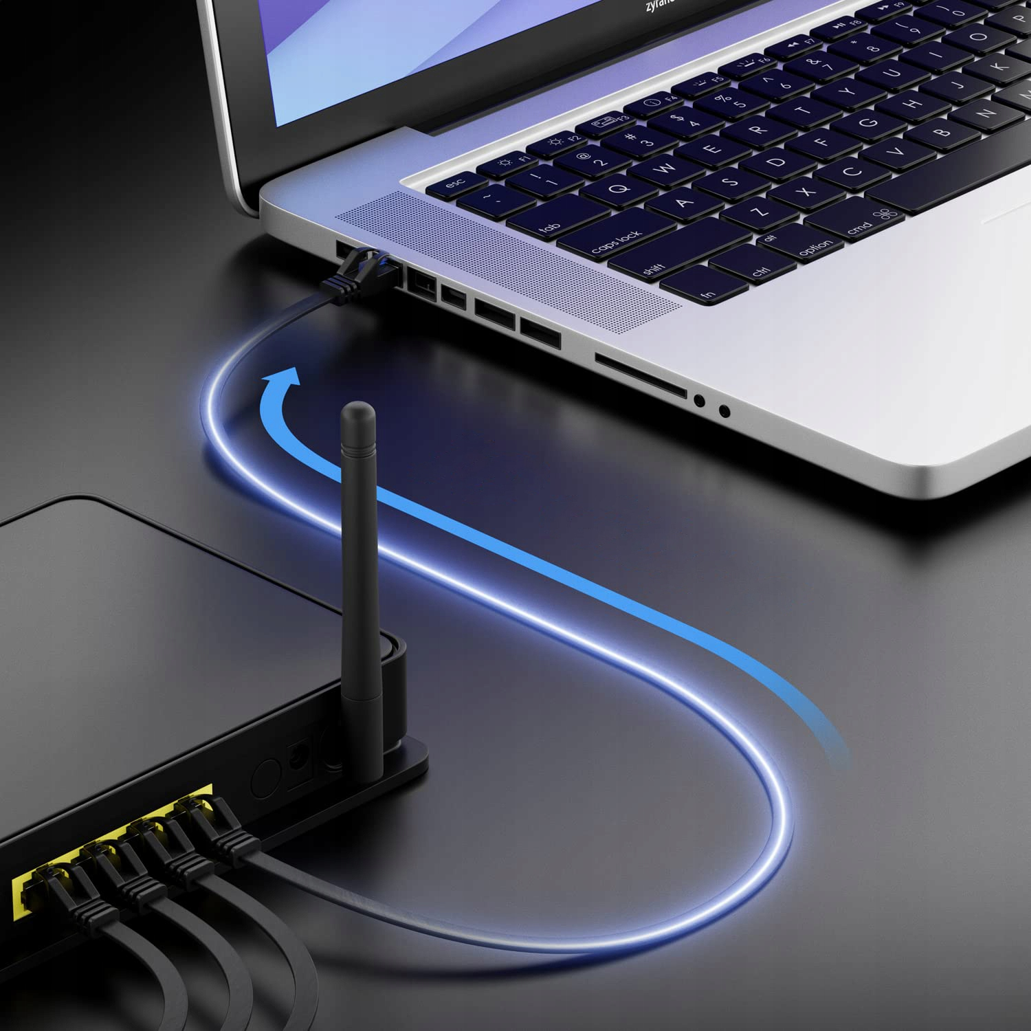 Router jest podłączony do laptopa kablem sieciowym.