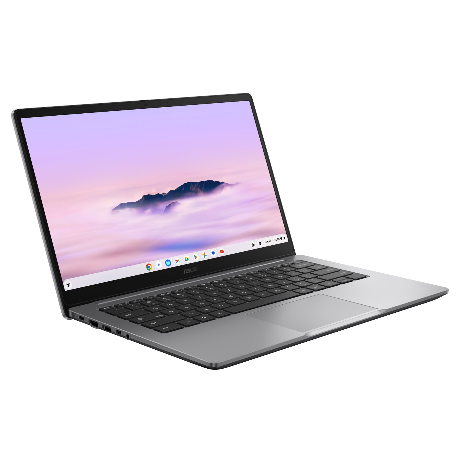 Srebrny laptop z otwartym ekranem, wyświetlający górski krajobraz.