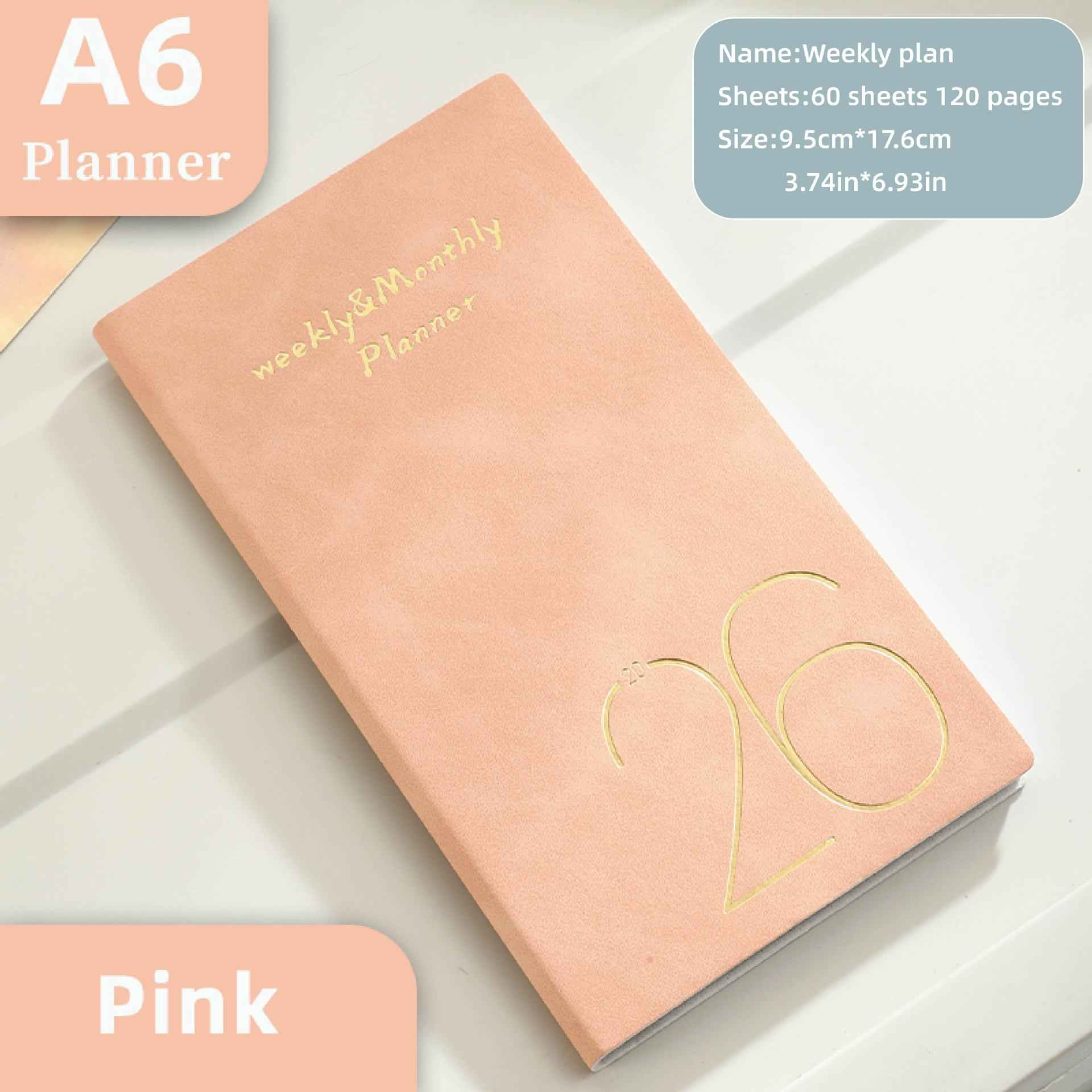 Ein rosafarbener A6-Planer mit goldener Aufschrift und Jahreszahl 20.