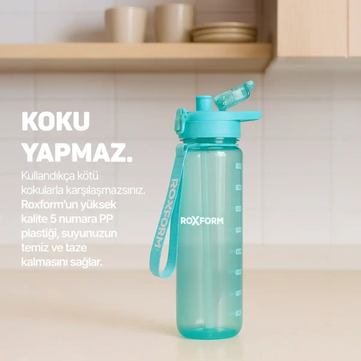 Turkuaz ROXFORM suluk, kapaklı ve askılı, ölçü işaretli.