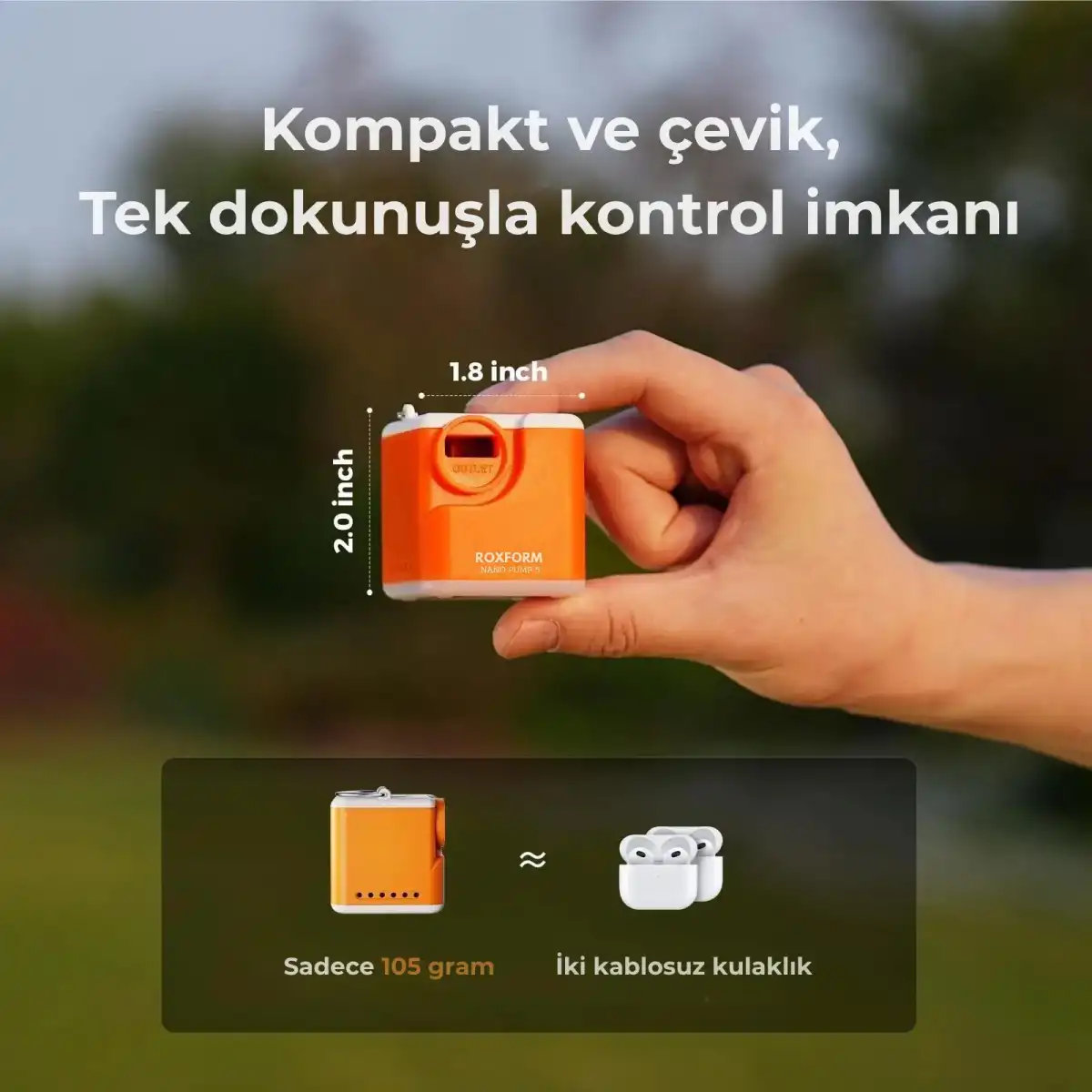 Bir el, 1,8x2,0 inç boyutlarında küçük turuncu bir cihaz tutuyor.