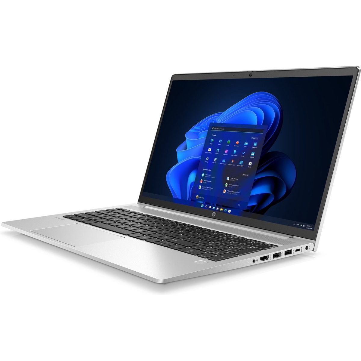 A silver laptop with its screen open, showing the Windows 11 start menu.