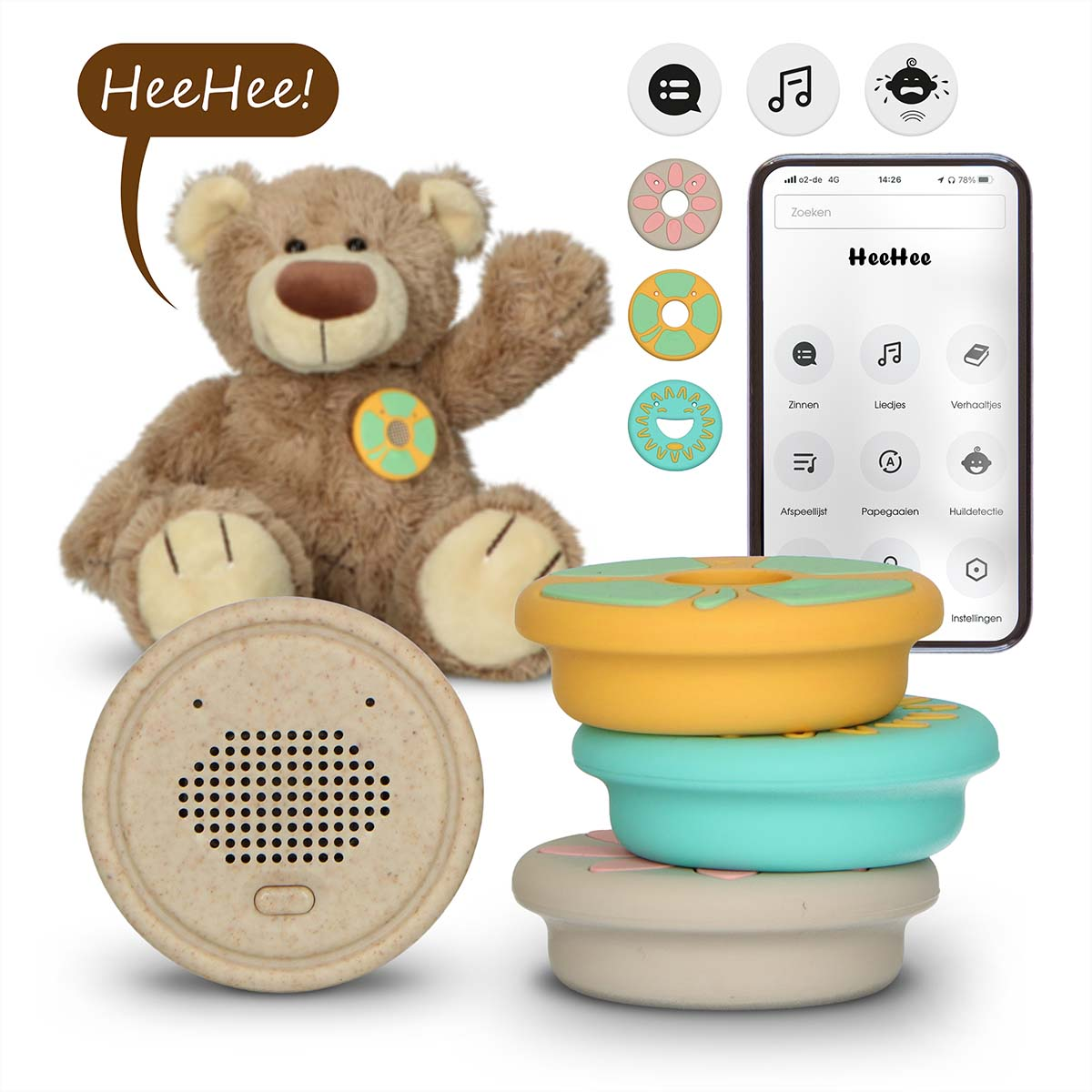 A teddy bear with a speaker and colorful rings next to it.