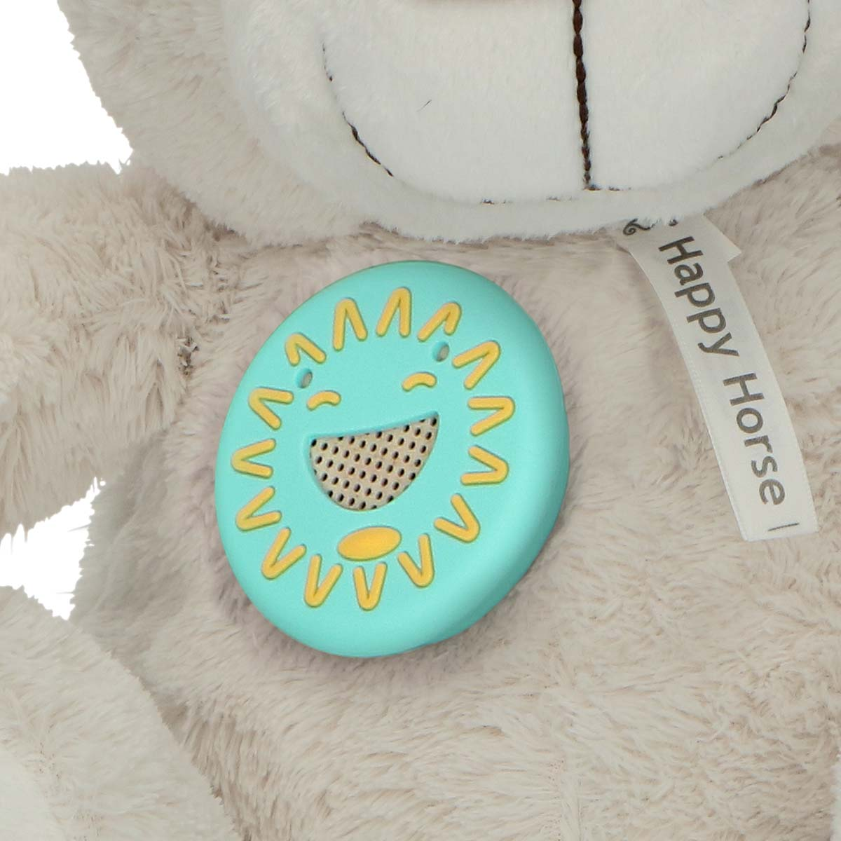 A light beige teddy bear with a light green sun module on its face.