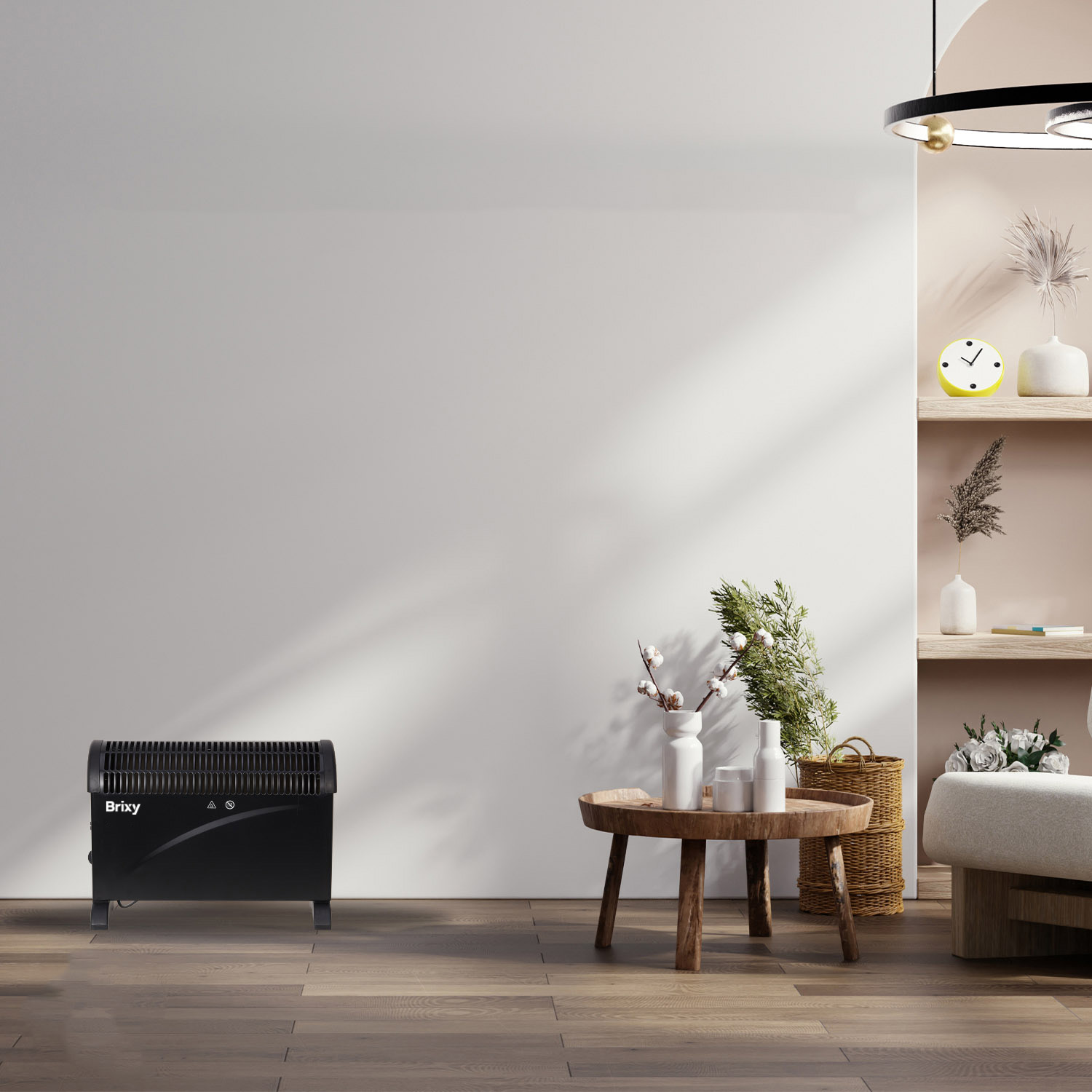 A black heater sits on a wooden floor next to a round wooden table with vases.