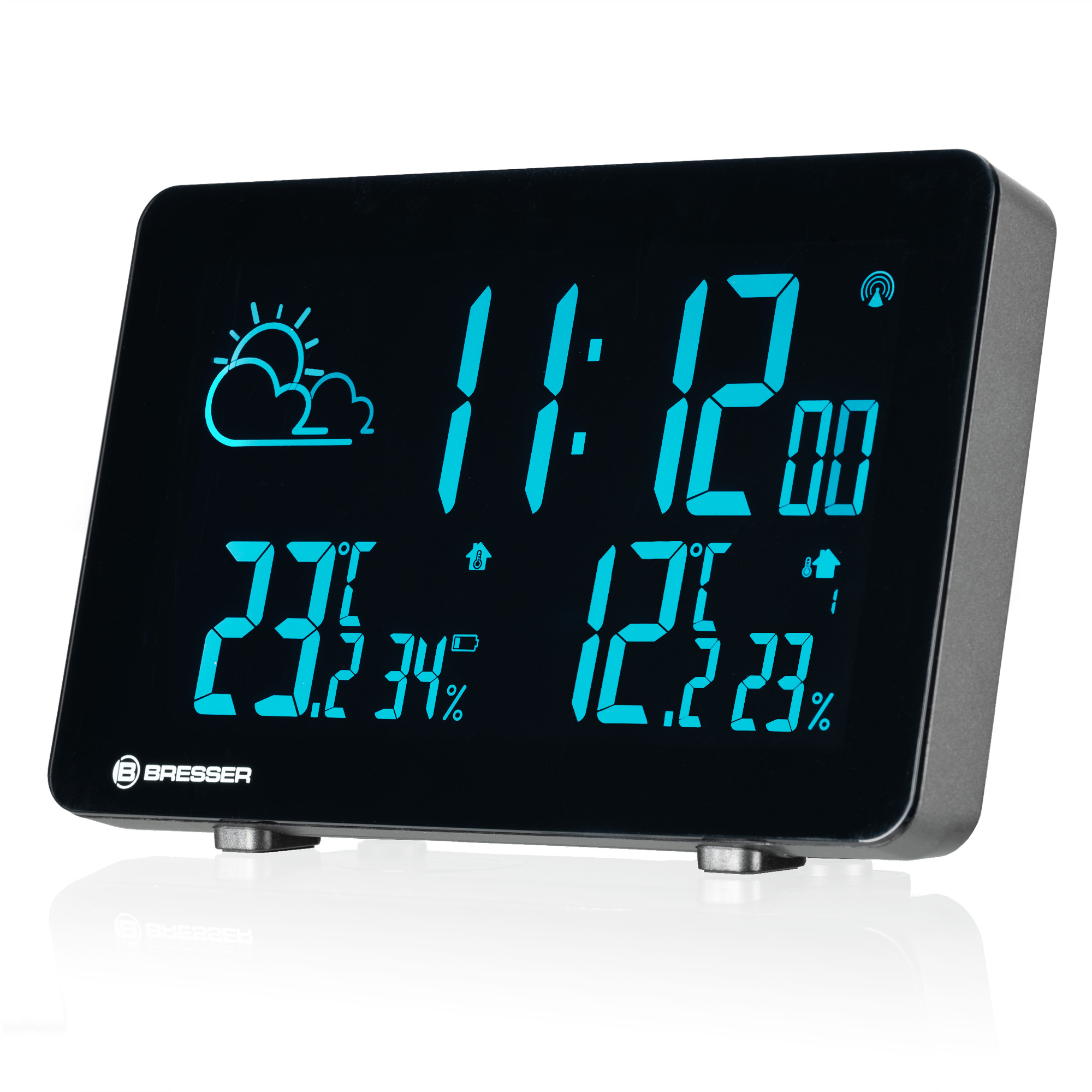 Reloj digital muestra 11:12, 23°C, 34% humedad, 12.2°C, 23% humedad.