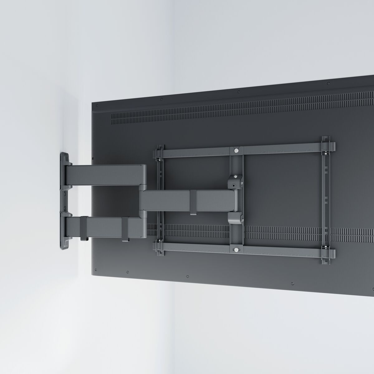 Obrotowy uchwyt ścienny do telewizora jest przymocowany do telewizora z płaskim ekranem.