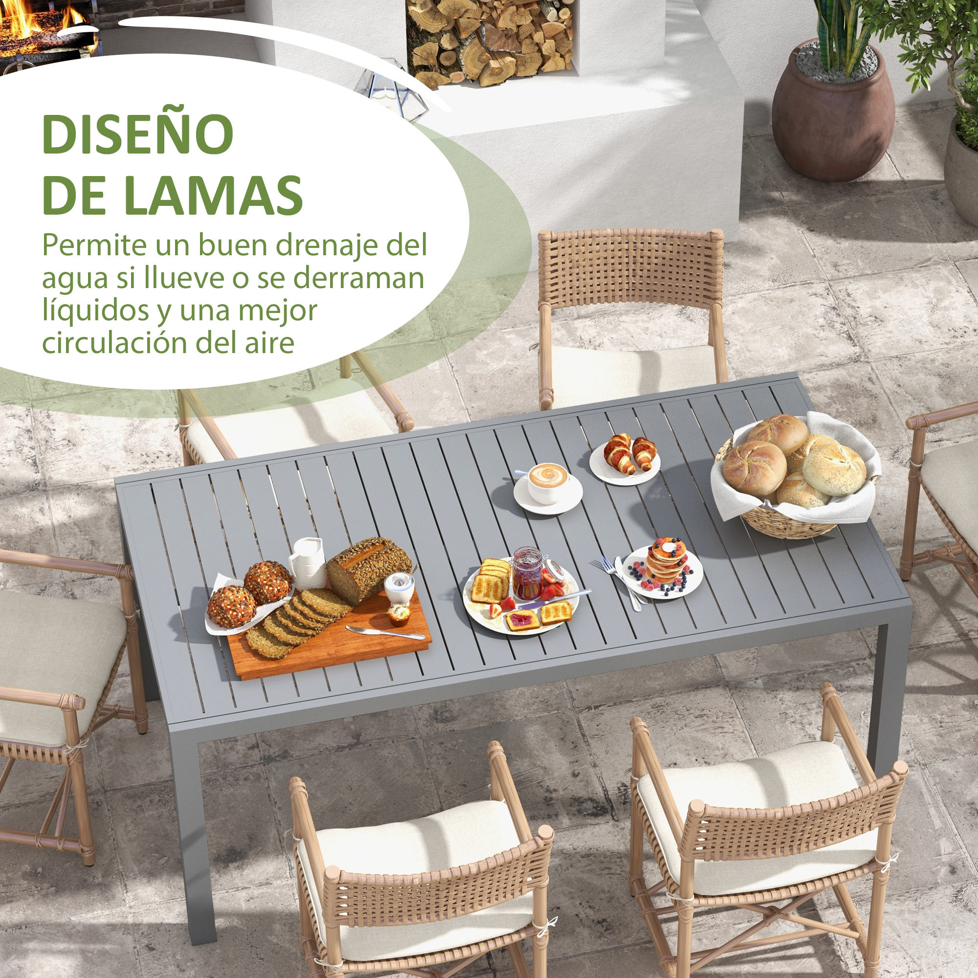 Mesa gris con desayuno, cestas y plantas al aire libre.