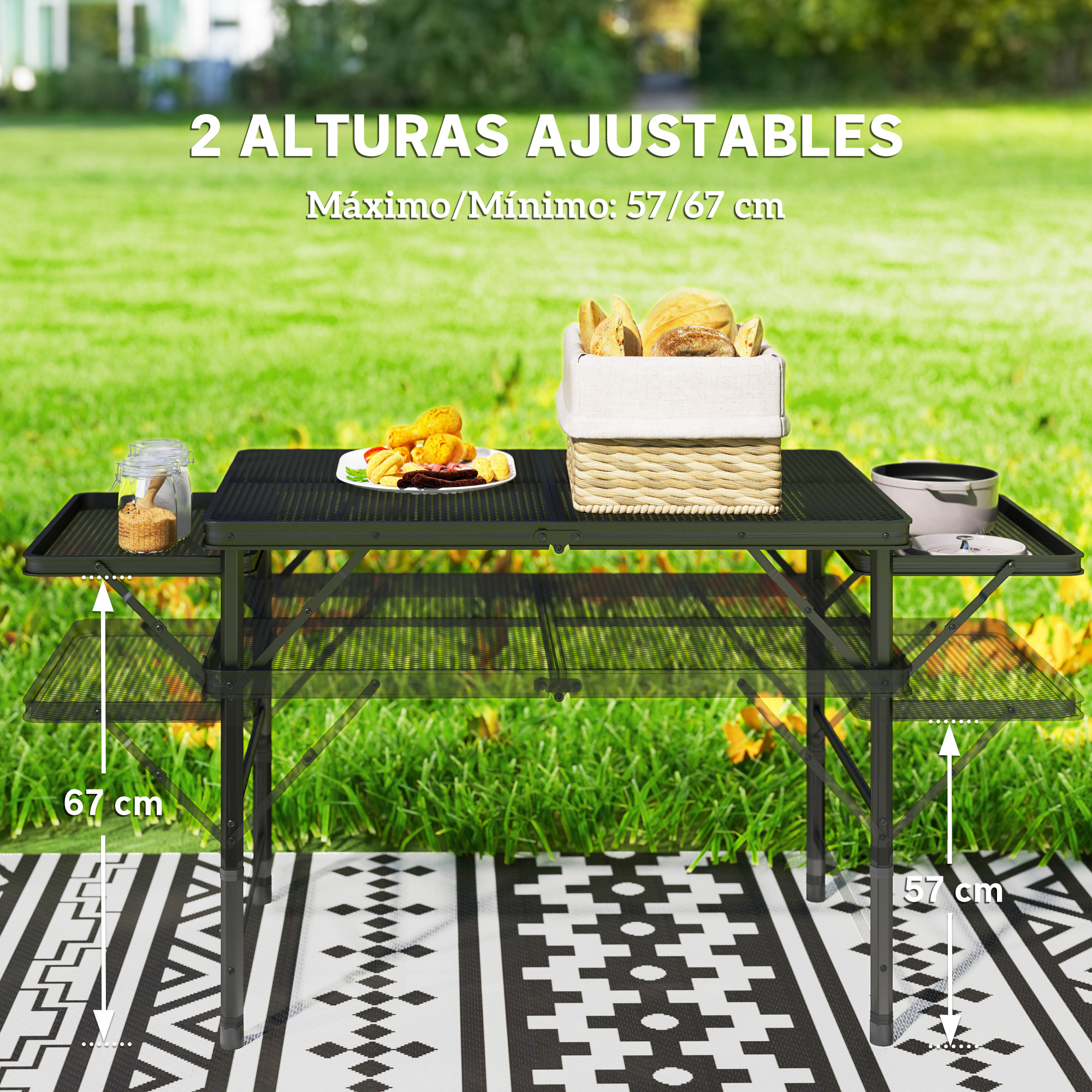 Una mesa de camping negra con dos alturas (57/67 cm) sobre una manta.