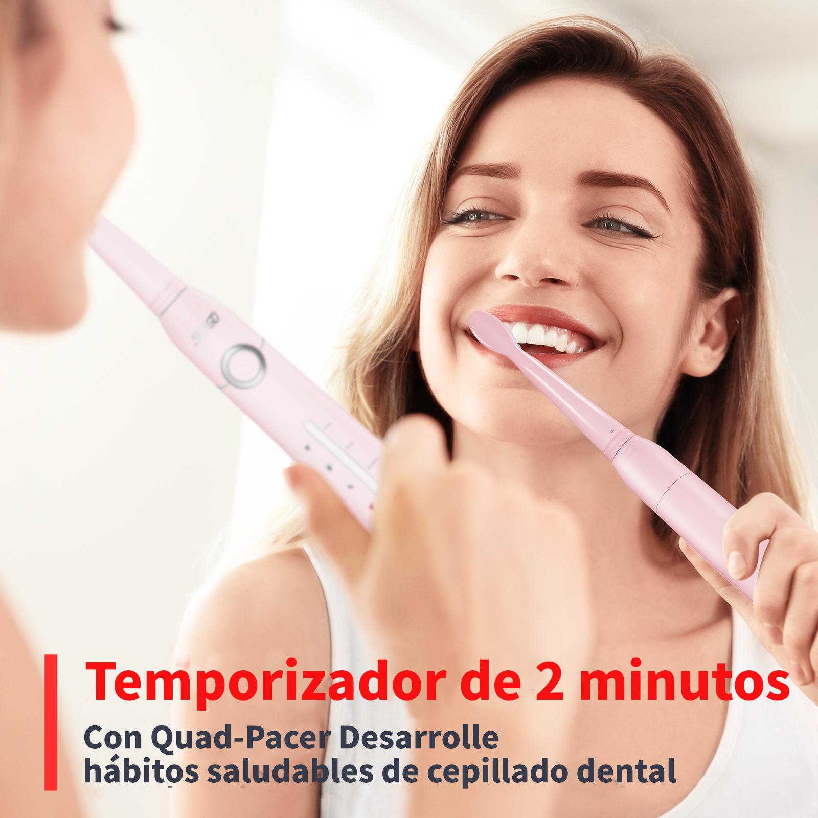 Una mujer se cepilla los dientes con un cepillo eléctrico rosa.