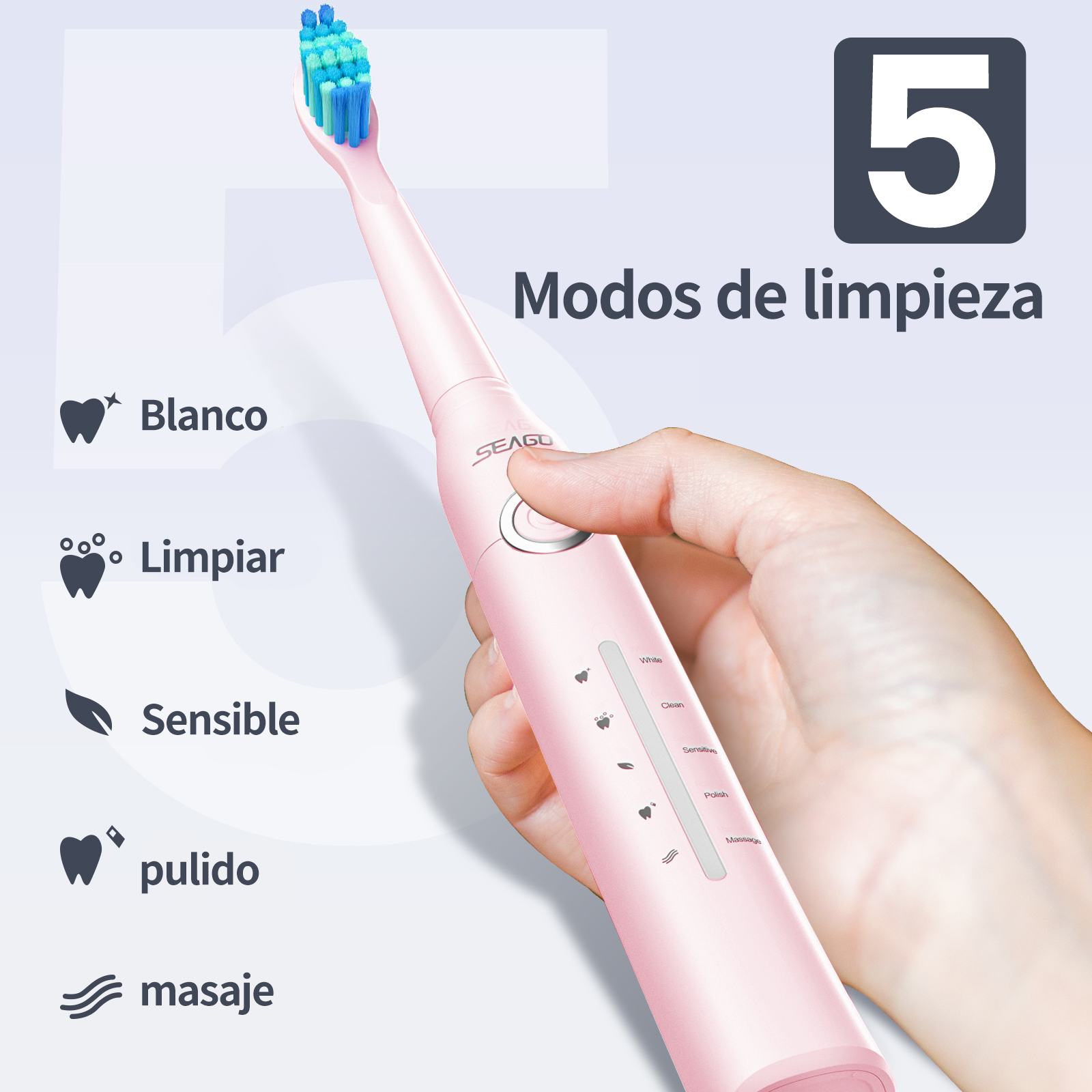 Una mano sostiene un cepillo de dientes eléctrico rosa con cerdas azules y verdes.