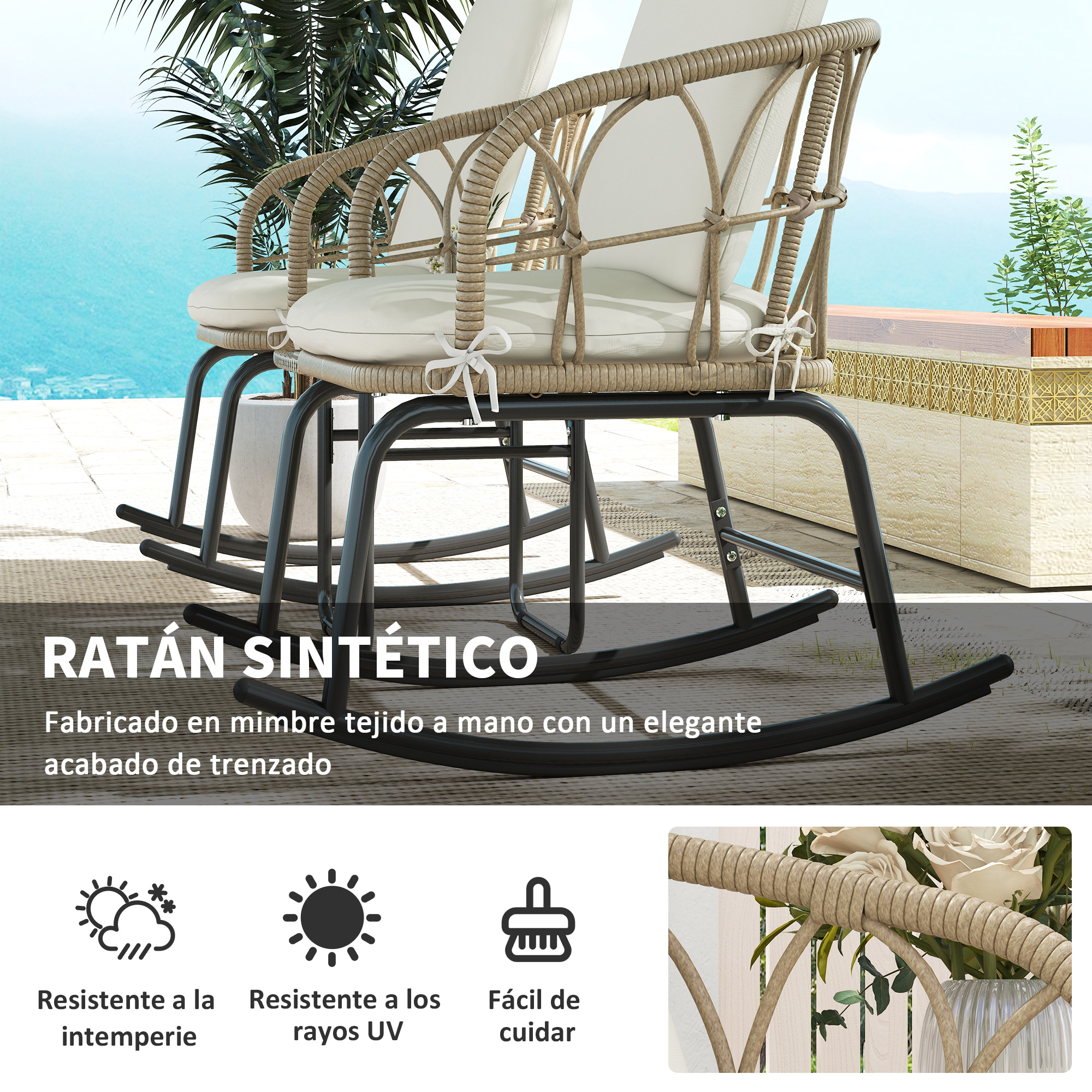 Dos sillas de ratán con cojines blancos en un patio con vistas al mar.