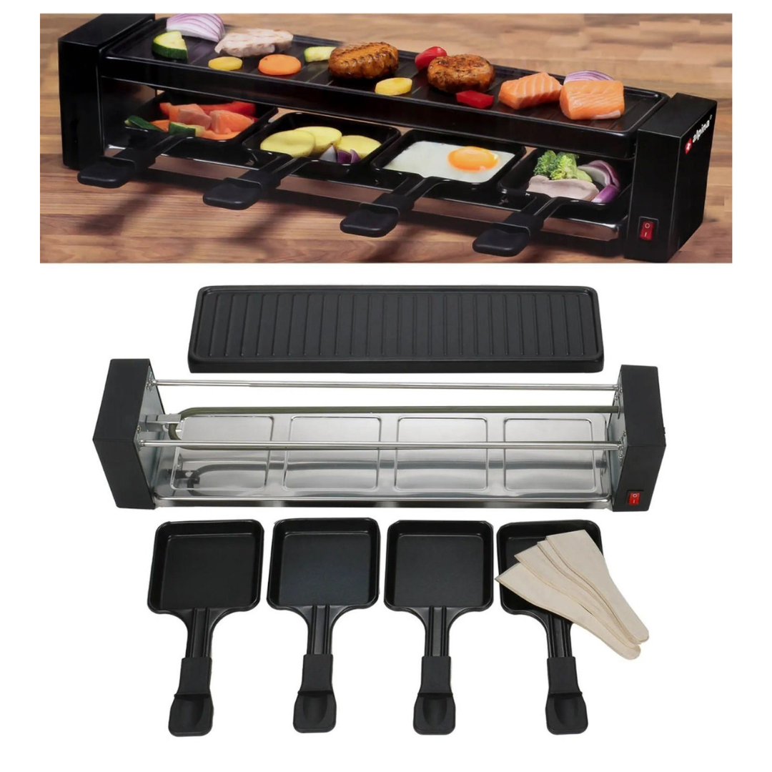 Ein Raclette-Grill mit Kochgeschirr und Pfannen auf einem Holztisch.