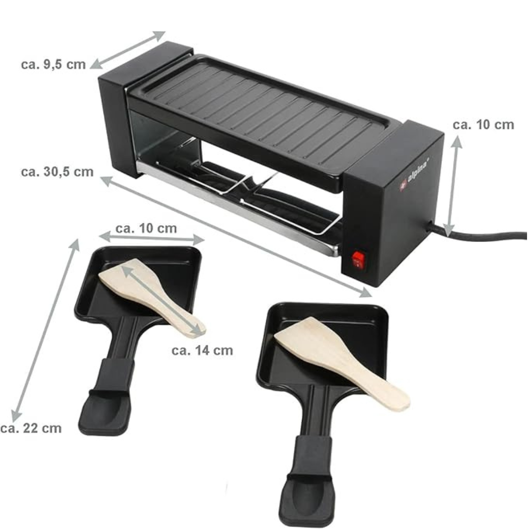 Kompakter Raclette-Grill mit zwei Pfännchen und Holzschiebern.