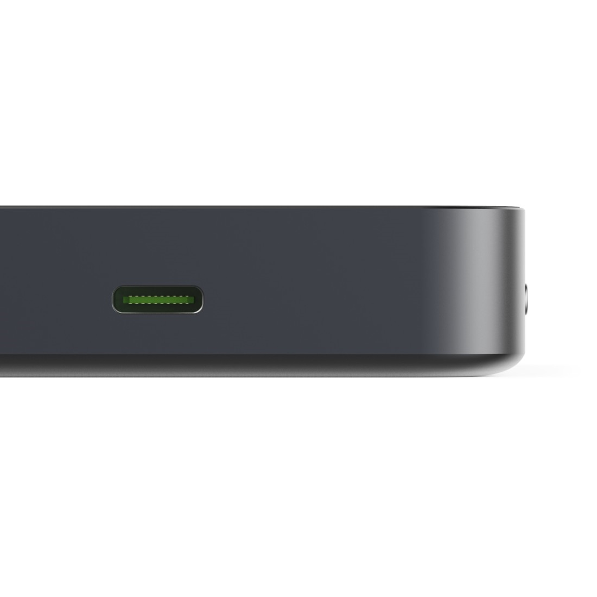 Ciemnoszare prostokątne urządzenie z portem USB-C z zielonymi pinami.