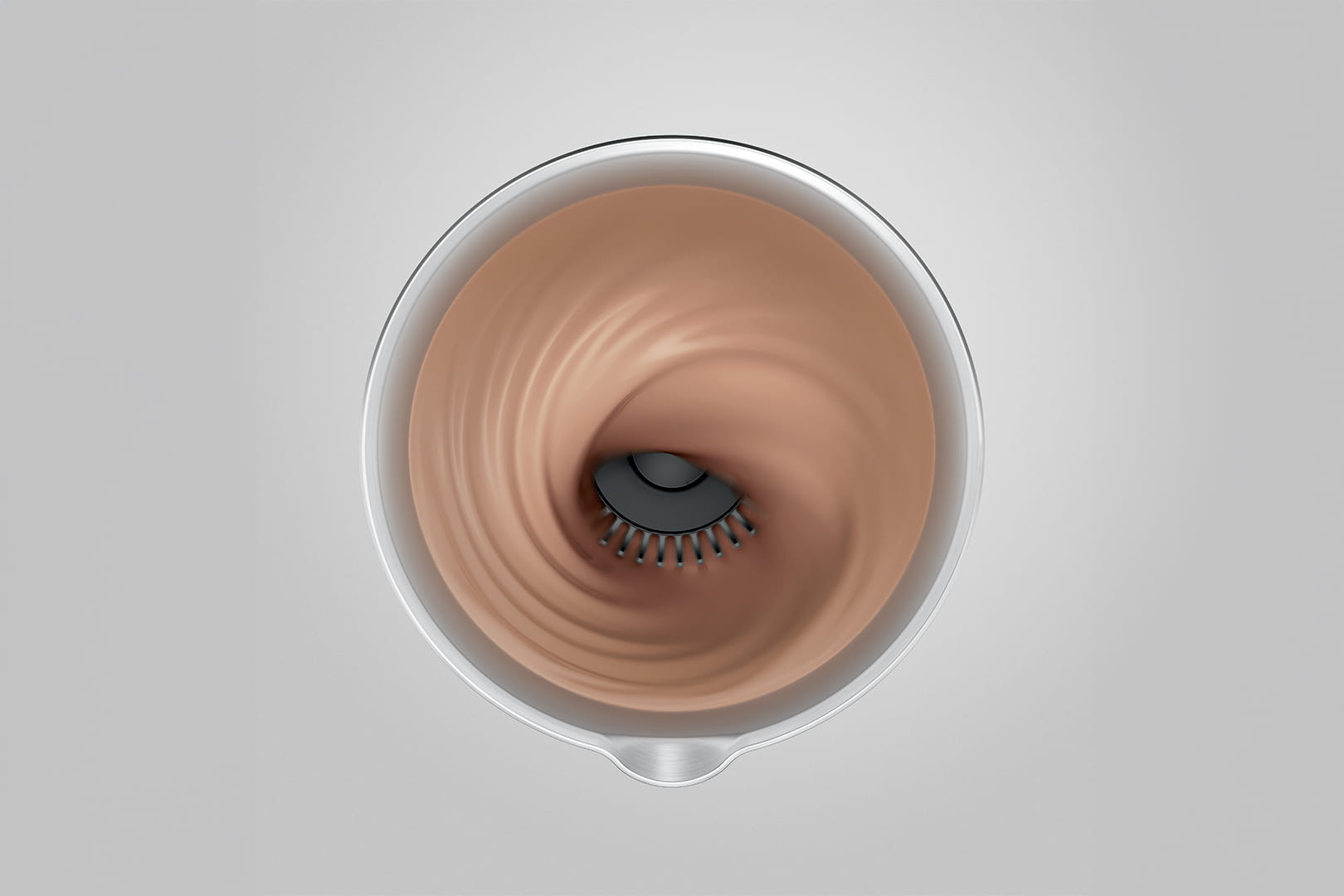 Un frullatore con liquido marrone che vortica attorno alle lame.