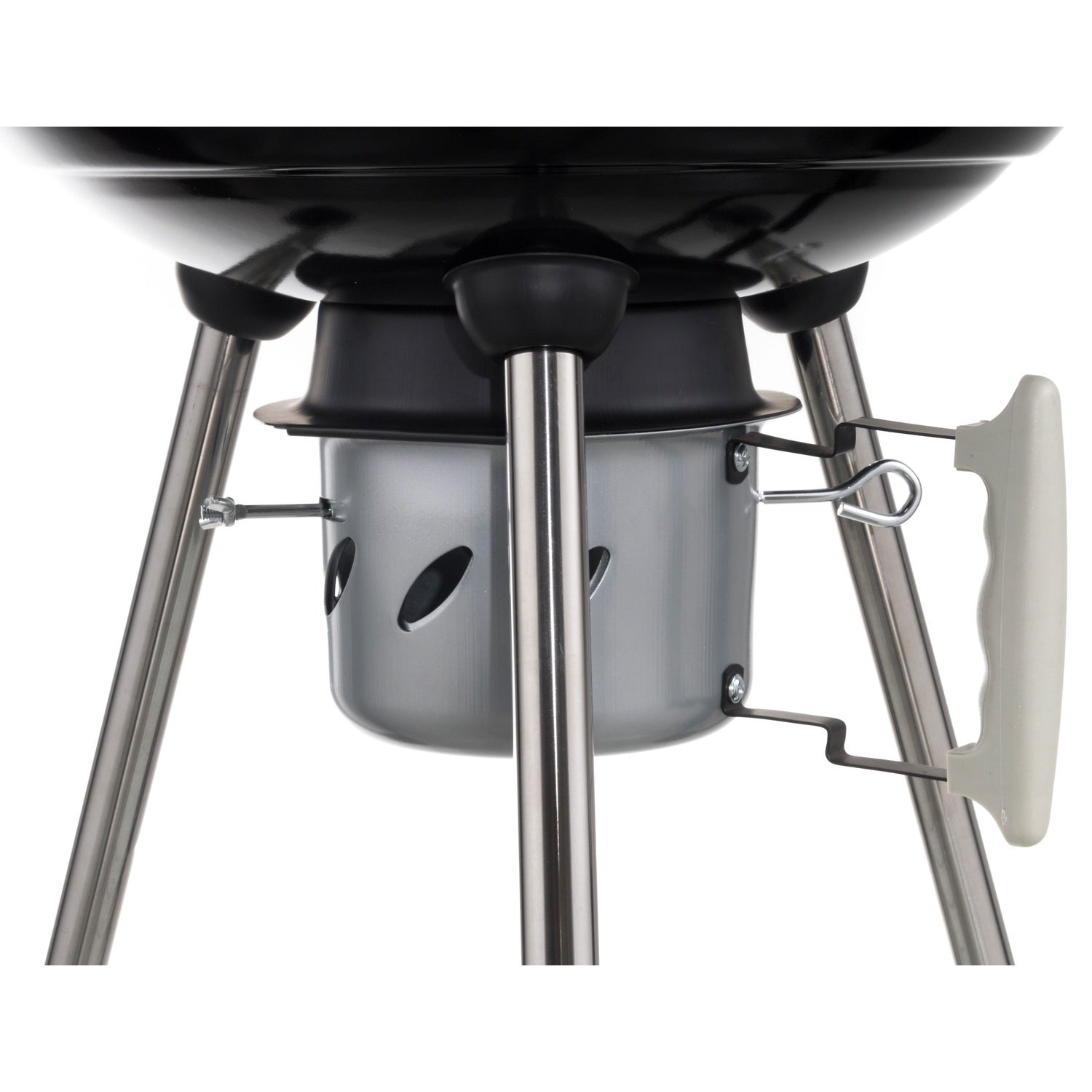 Close-up of a black grill with metal legs and a silver ash catcher.