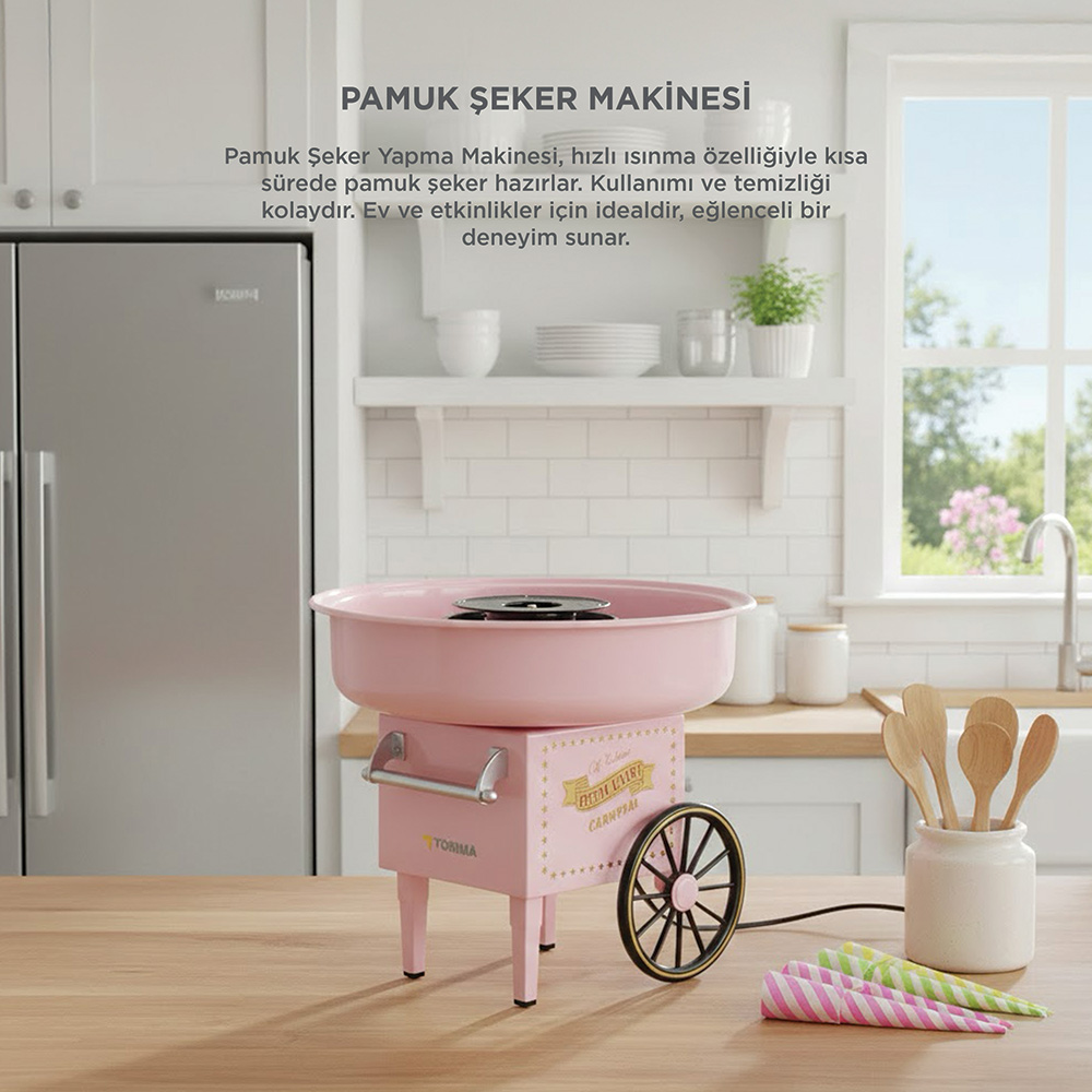 Pembe pamuk şeker makinesi mutfaktaki ahşap masada duruyor.