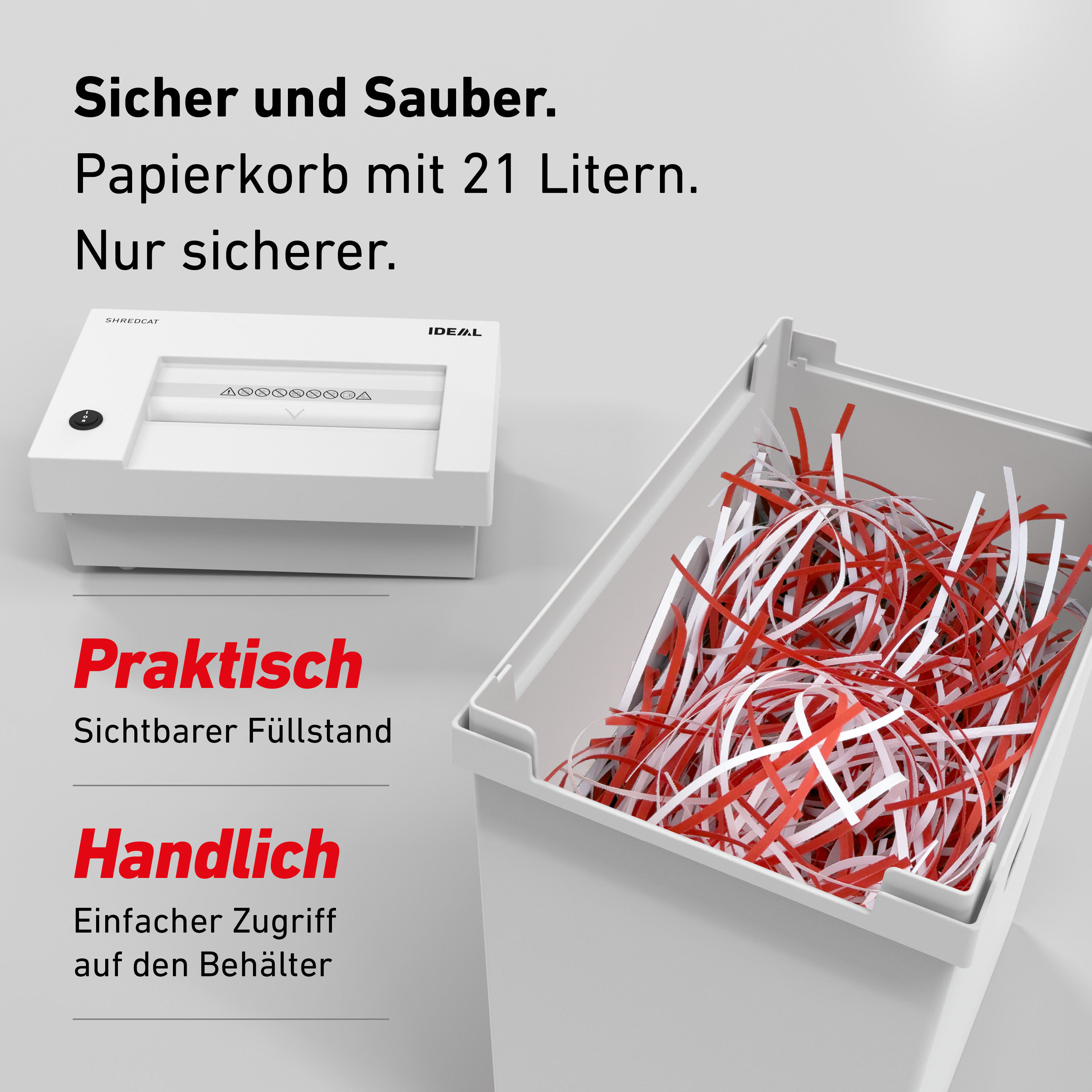 Ein weißer Aktenvernichter neben einem Papierkorb voller rot-weißer Streifen.
