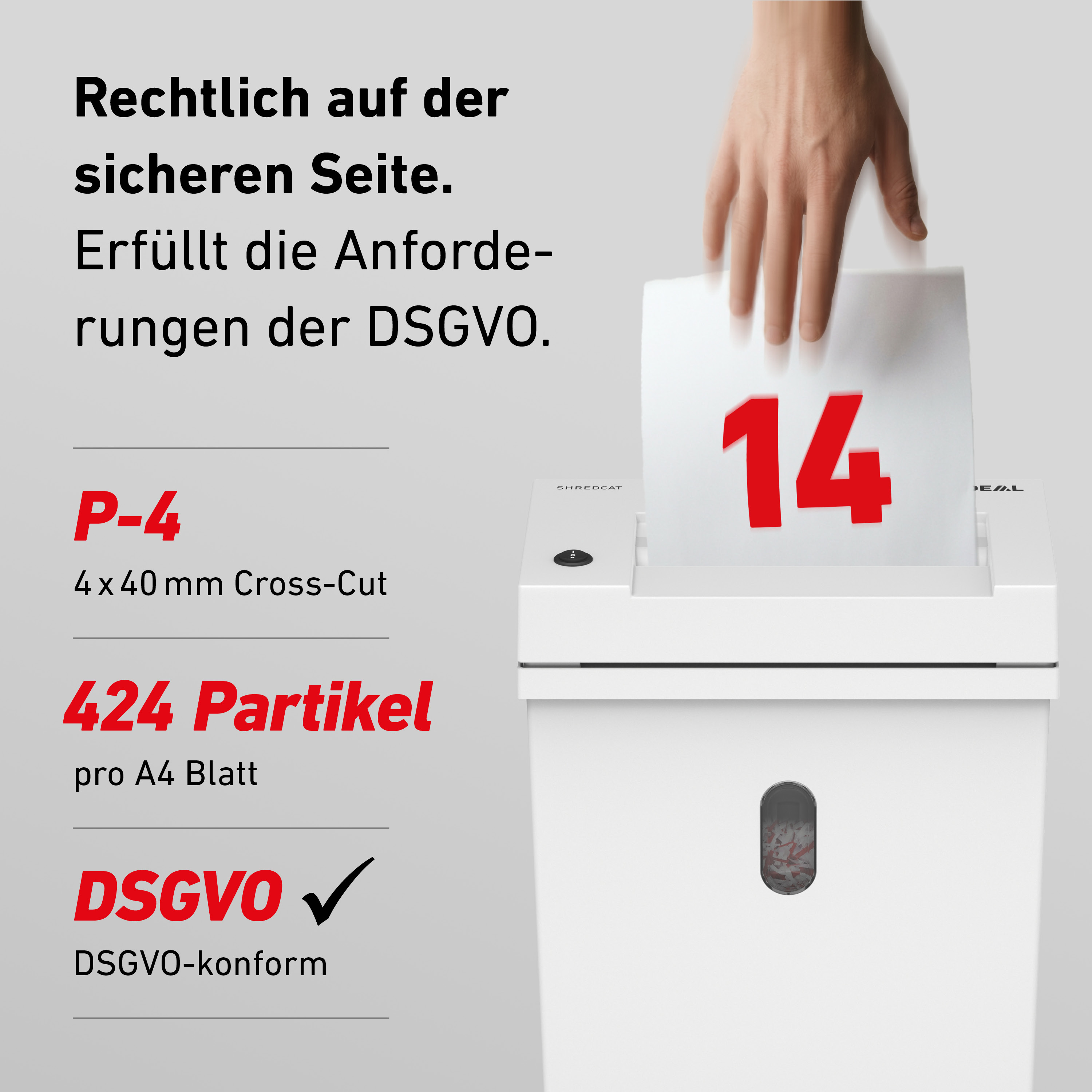 Ein Blatt Papier mit der Zahl 14 wird in einen weißen Aktenvernichter eingelegt.
