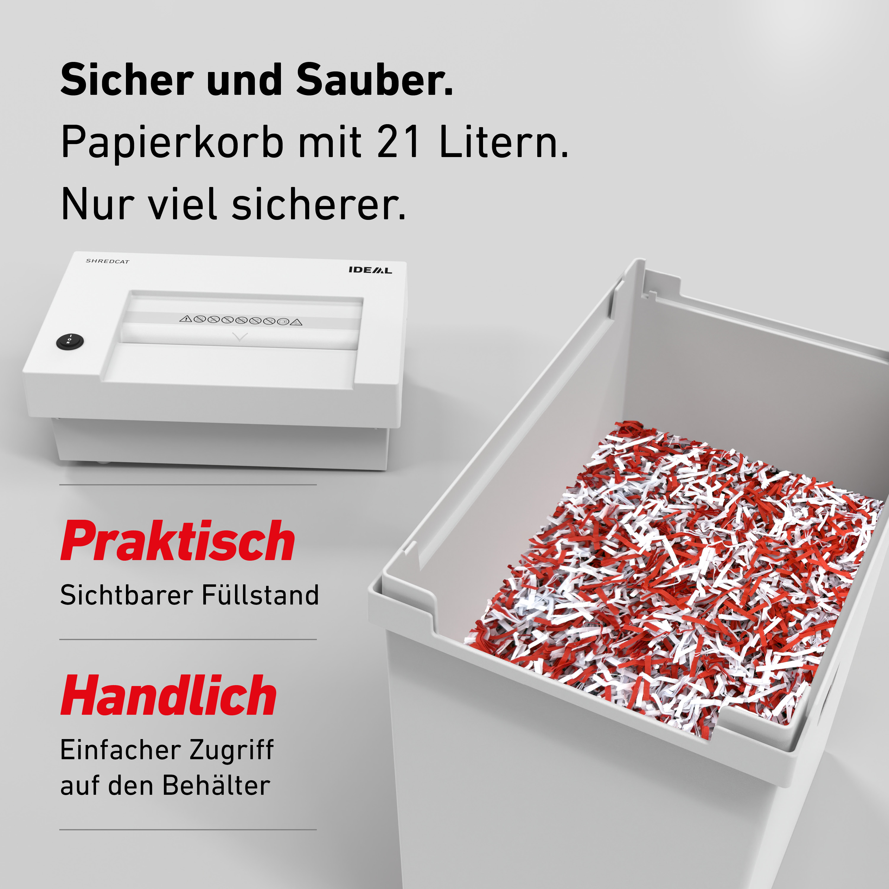 Ein weißer Aktenvernichter steht neben einem Korb mit rot-weißen Papierschnipseln.