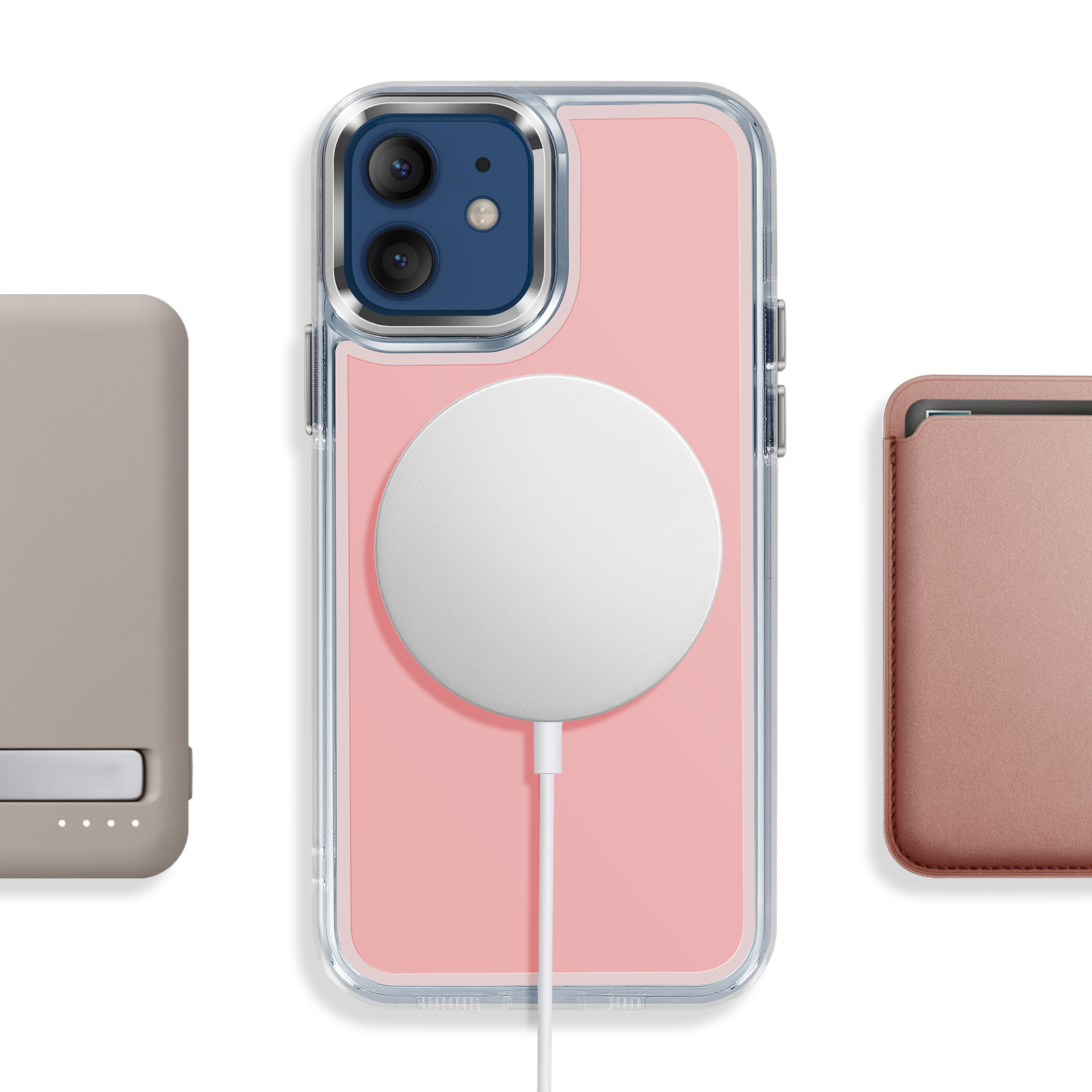 Un iPhone rose avec chargeur MagSafe, à côté d'une banque d'alimentation grise et d'une coque rose.