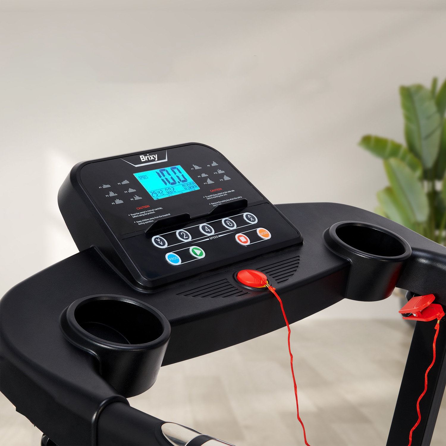 Close-up of a treadmill console with display, buttons, and cup holders.