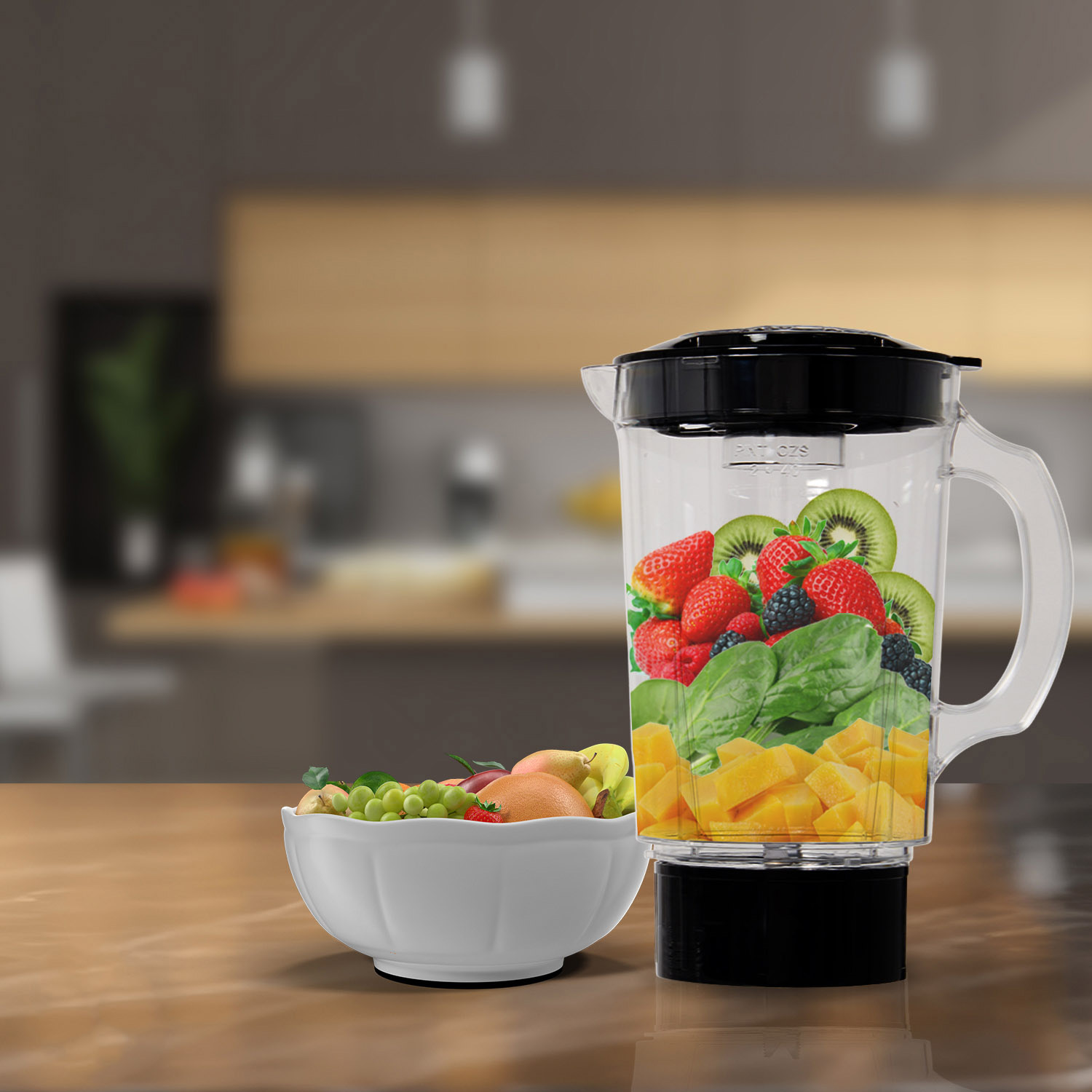 A blender filled with fruit and vegetables, next to a bowl of fruit.