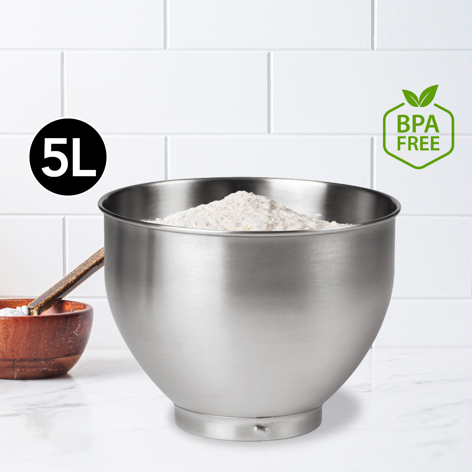 Stainless steel bowl filled with flour, next to a wooden bowl. BPA-free.