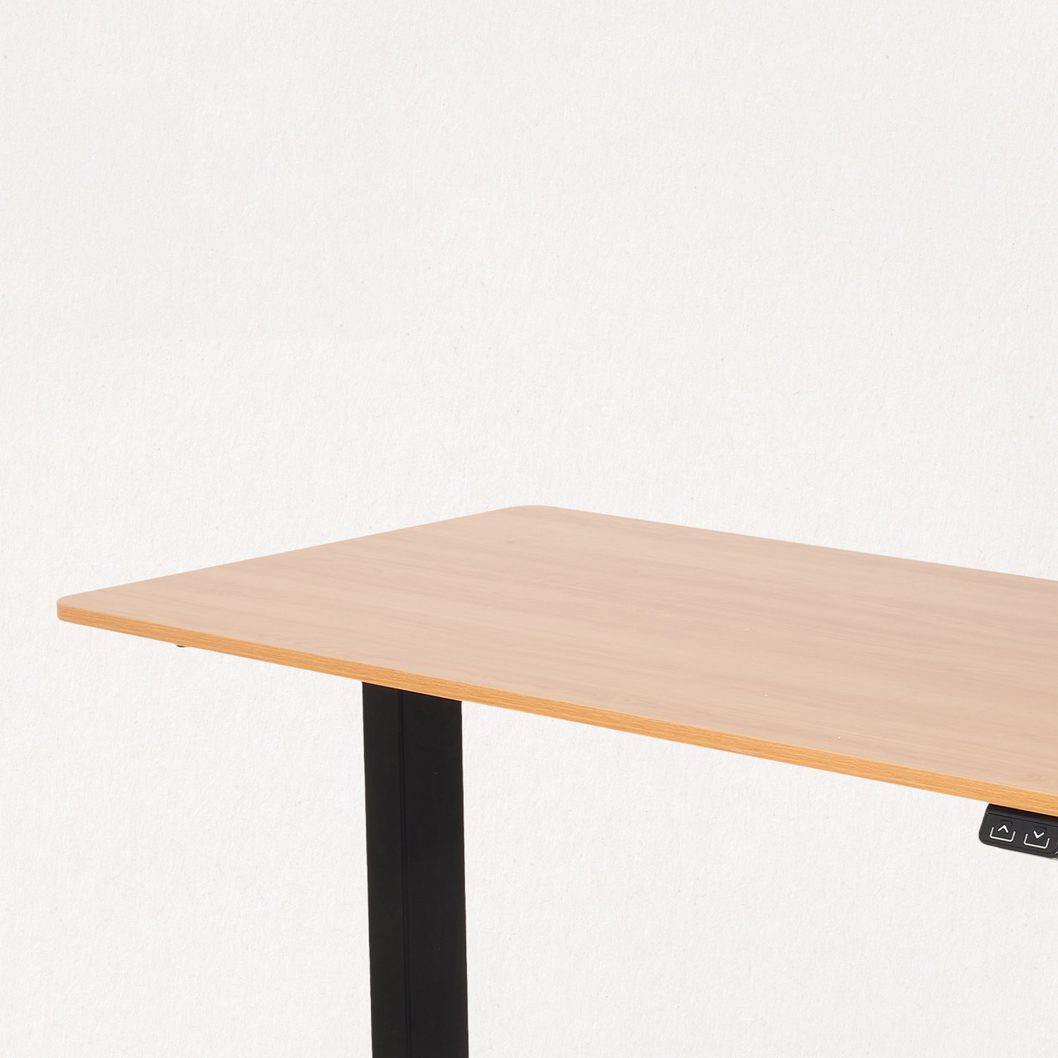 A light wood desk with a black leg and control panel.