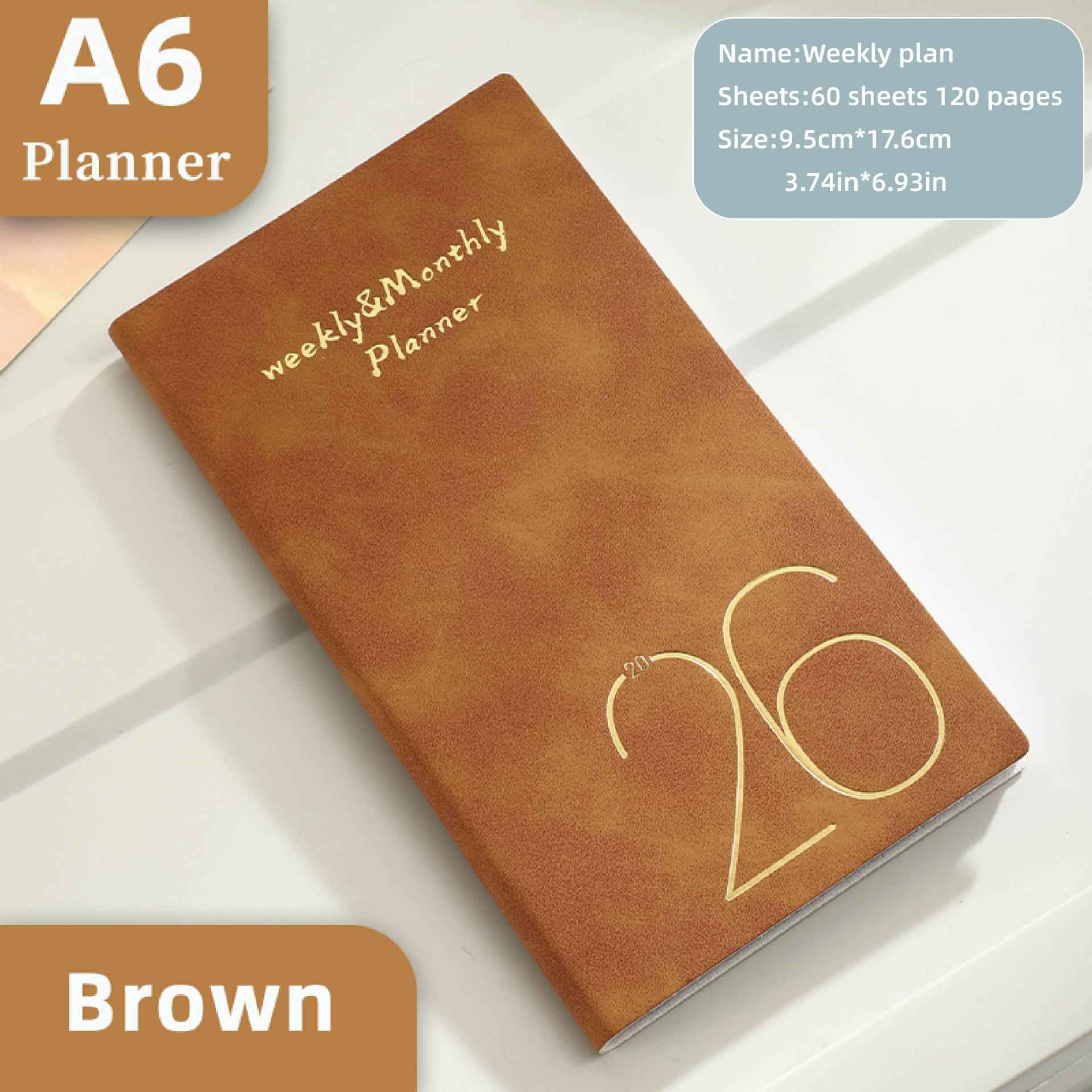 Brauner A6 Wochenplaner mit goldener 26 und Schriftzug.