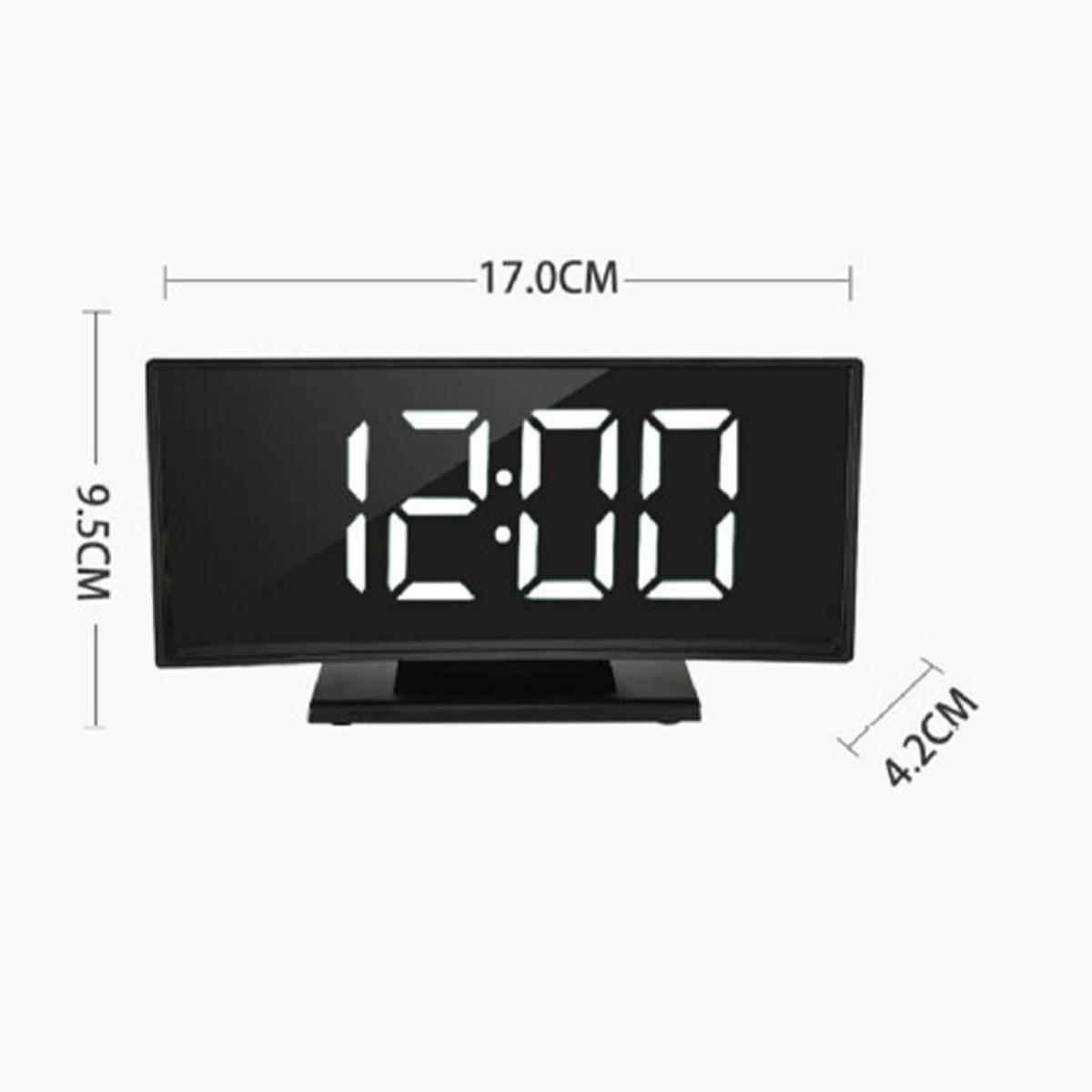 Eine Digitaluhr zeigt 12:00 an. Maße: 17,0 cm x 9,5 cm x 4,2 cm.