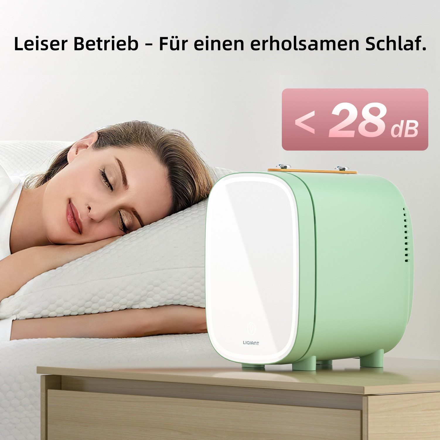 Eine Frau schläft auf einem Kissen neben einem grünen Gerät mit <lt/> 28 dB.