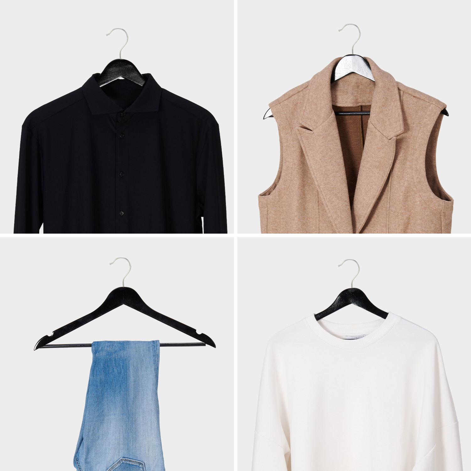 Vier kledingstukken aan hangers: zwart hemd, beige vest, spijkerbroek, witte trui.