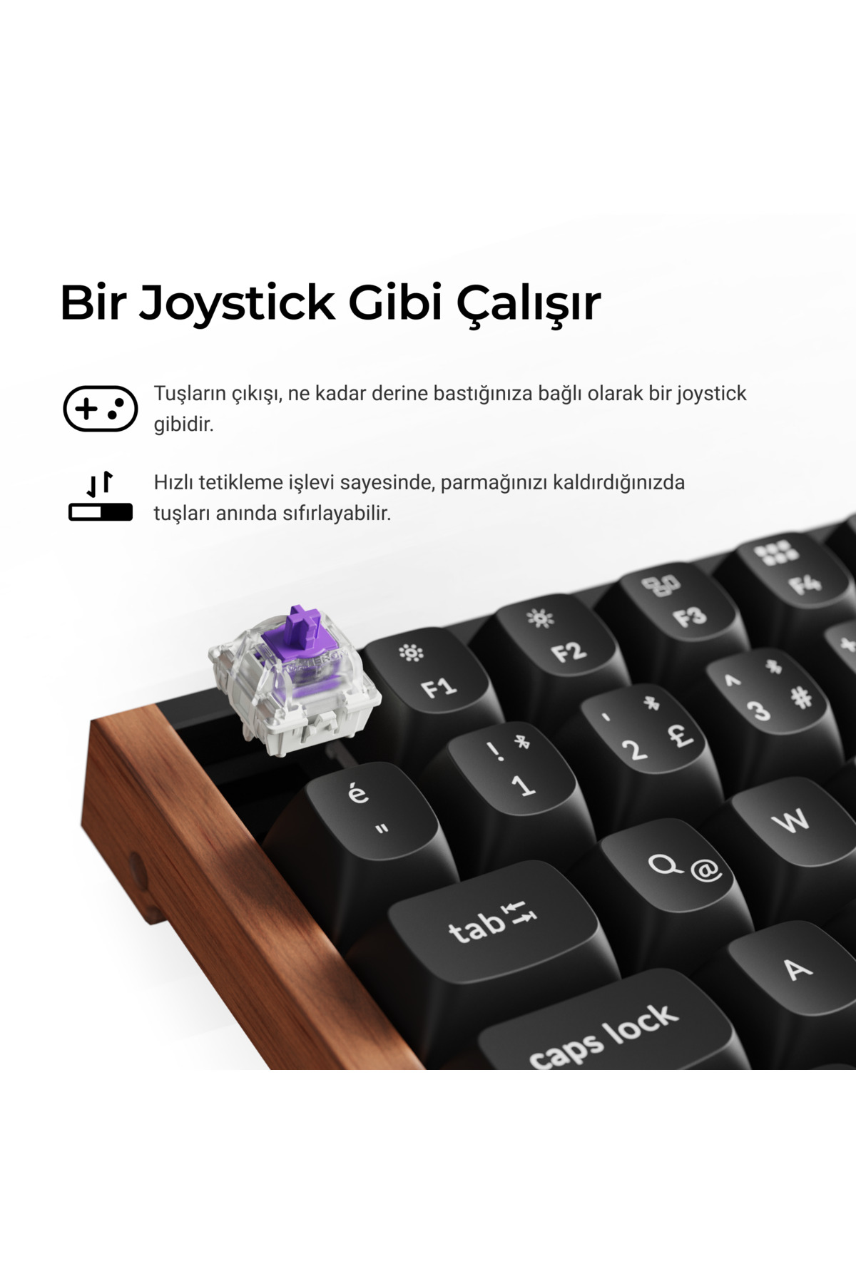 Ahşap kenarlı klavyede mor bir klavye anahtarı.