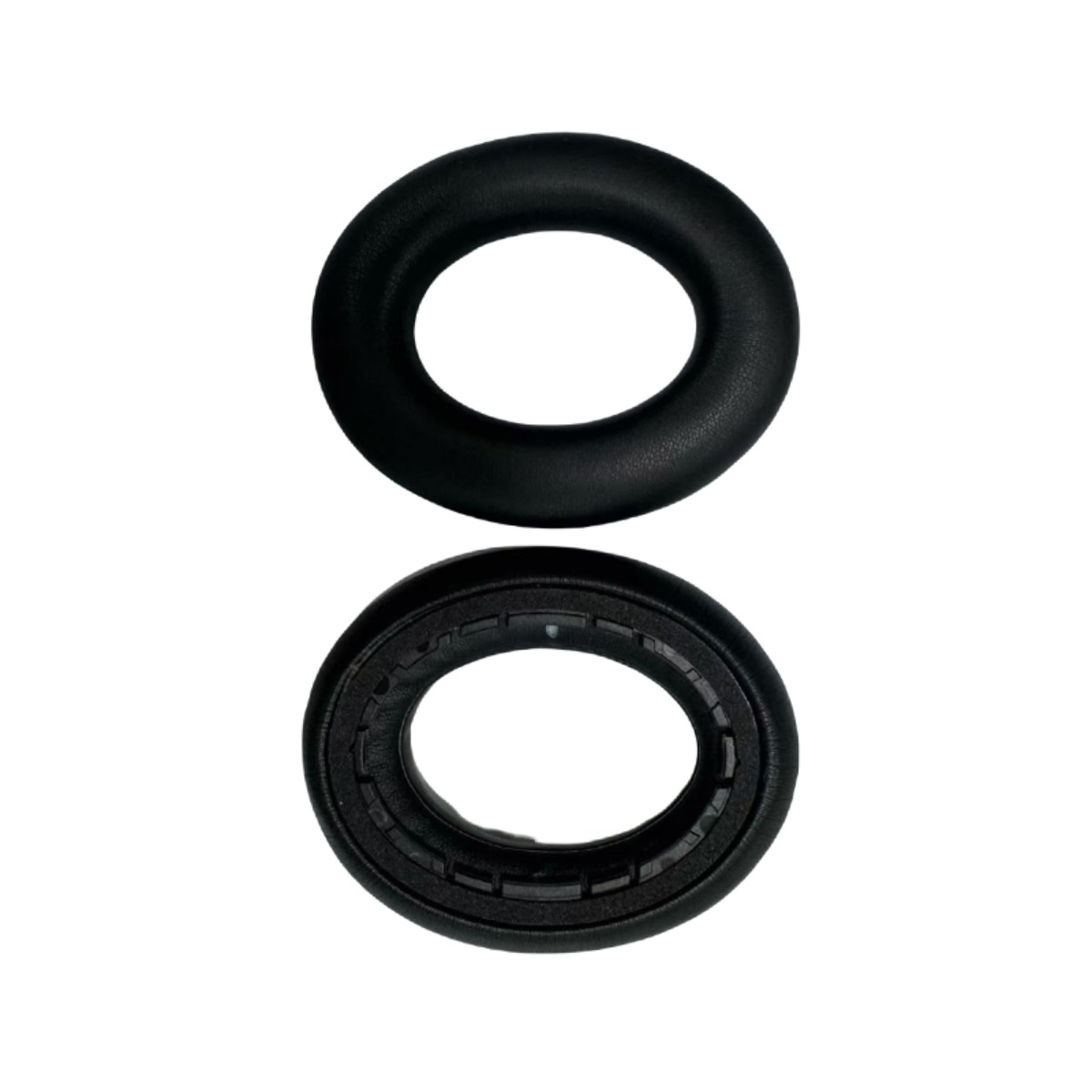 Two black ear pads side by side on a white background.