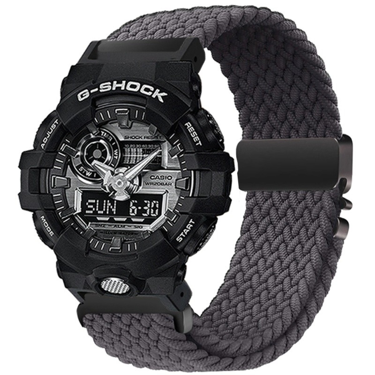 Orologio G-Shock nero con cinturino in tessuto grigio e display digitale.