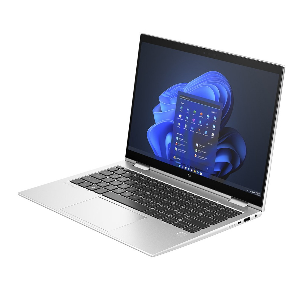 Un portátil HP EliteBook plateado con la pantalla abierta, mostrando Windows 11.