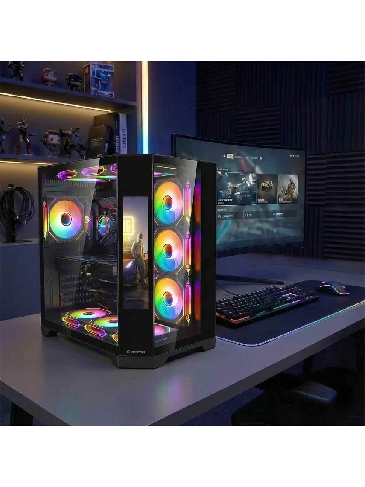 RGB fanlı bir oyuncu bilgisayarı masada monitörün yanında duruyor.