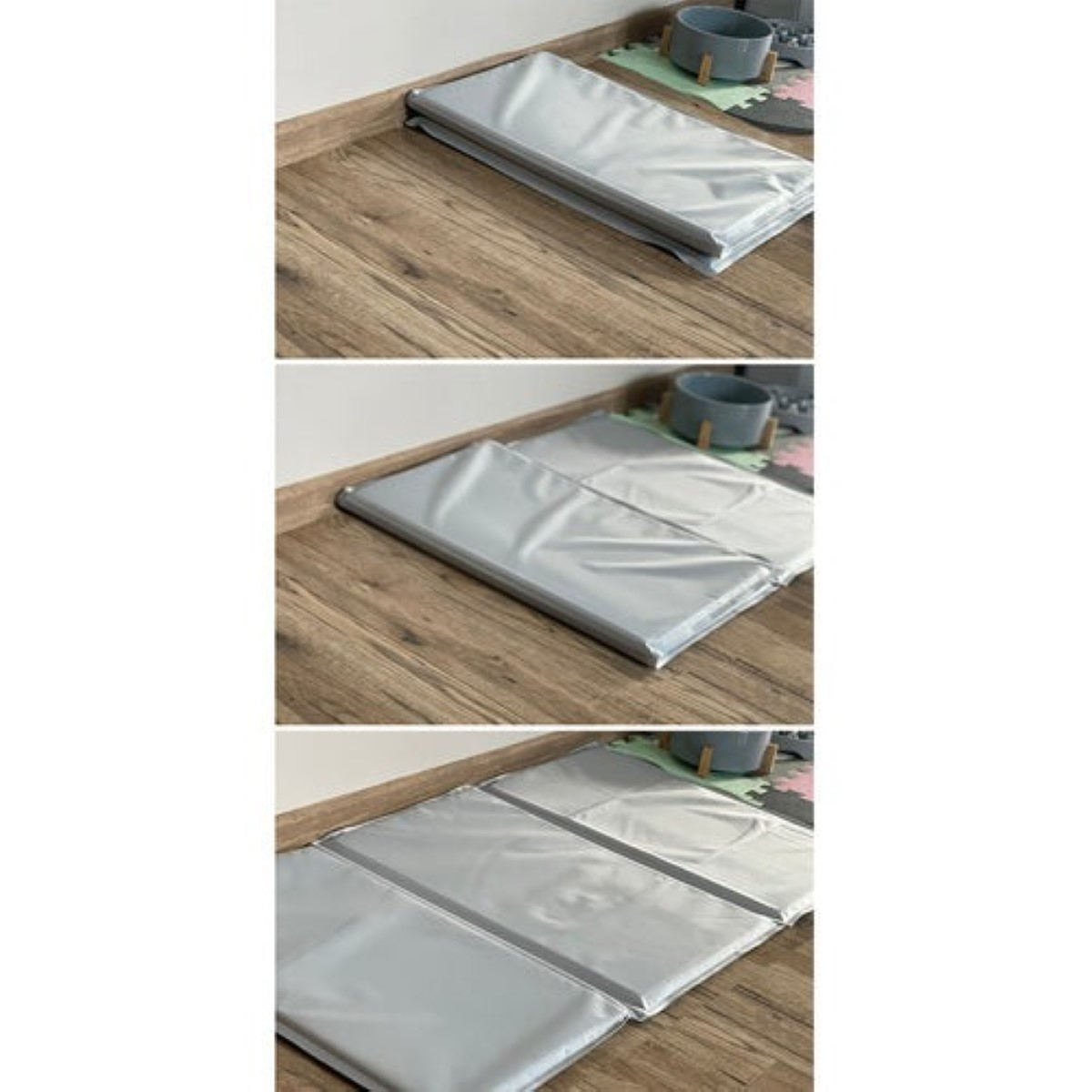 Una alfombra plateada plegable sobre suelo de madera.