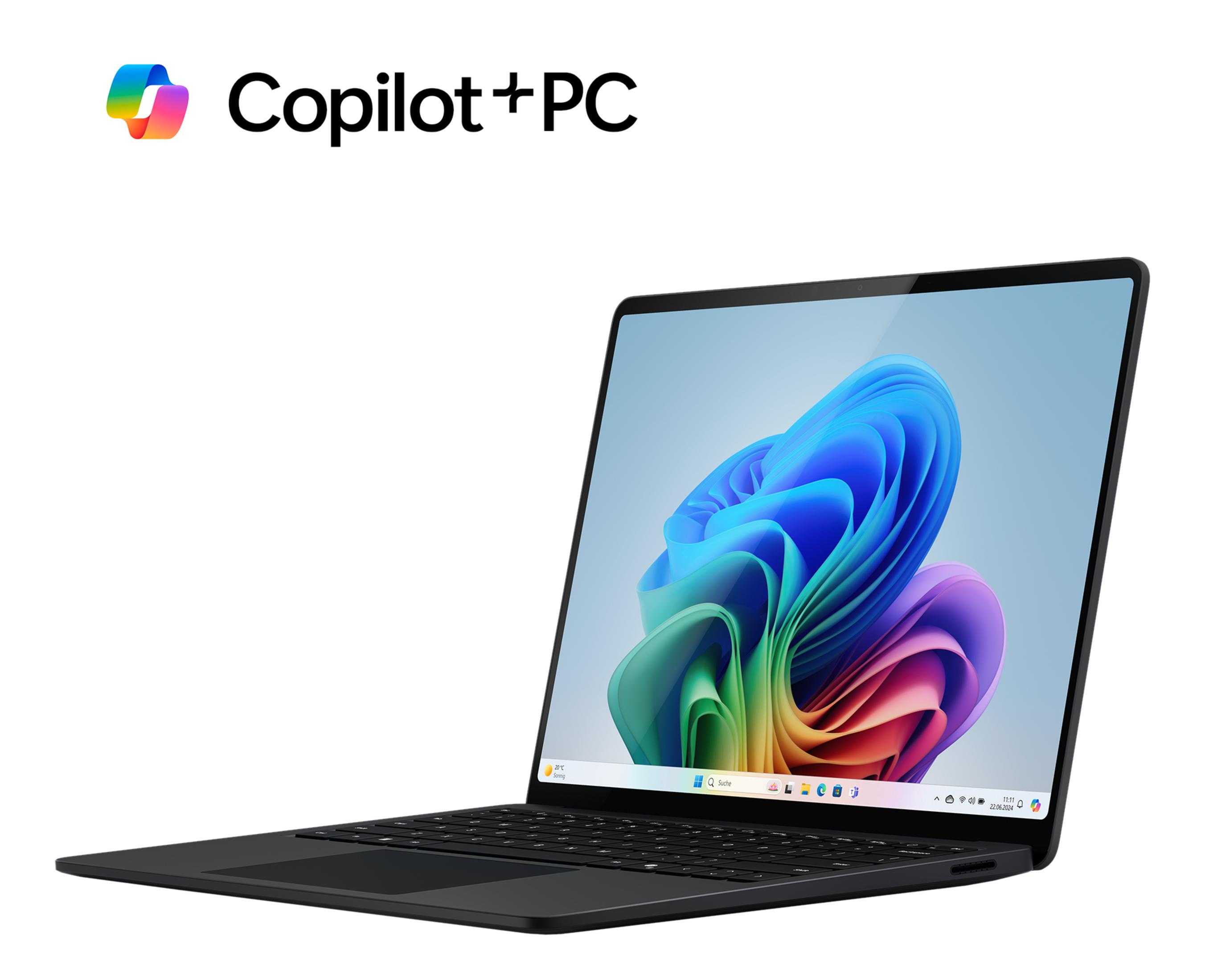 Un ordinateur portable noir avec le logo Copilot+ PC. L'écran affiche un fond d'écran abstrait et coloré.
